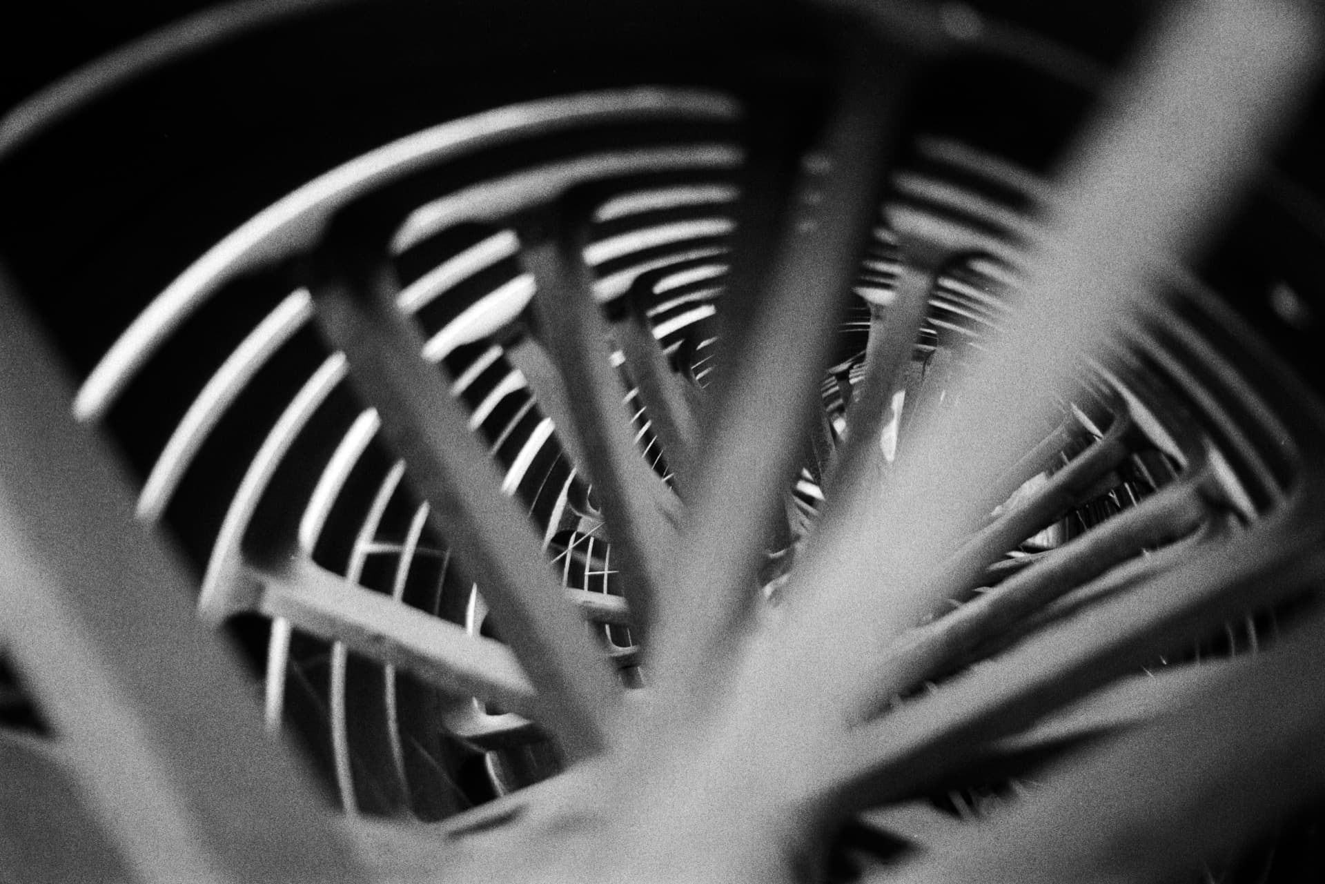 Abstract view through ridged cylindrical interior of agricultural machinery with selective focus