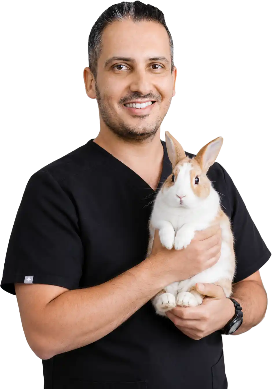 Dr. J. Yeganeh holding a rabbit to highlight specialised veterinary care for exotic pets.
