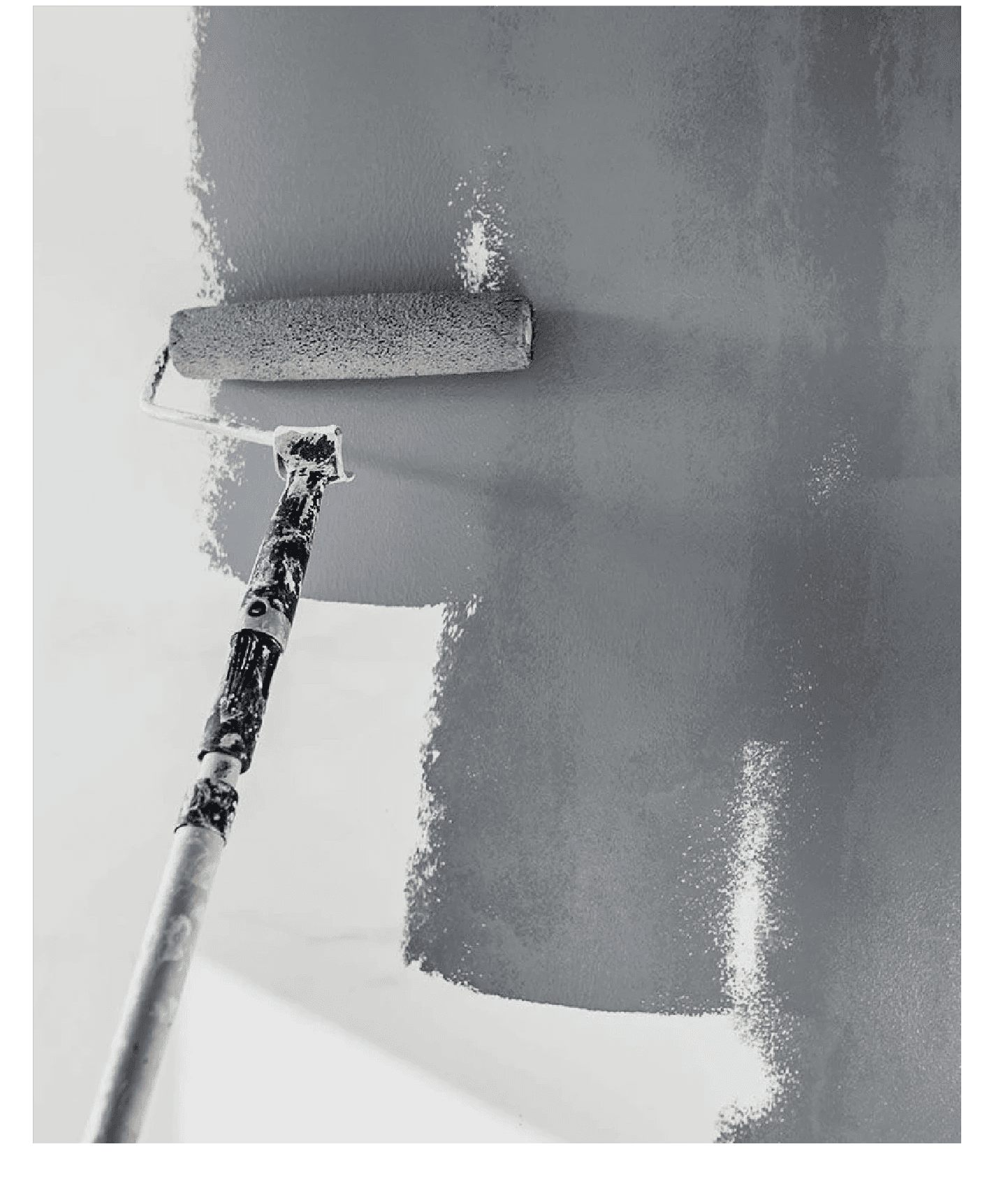 Entrance of a modern glass building with illuminated facade and reflections