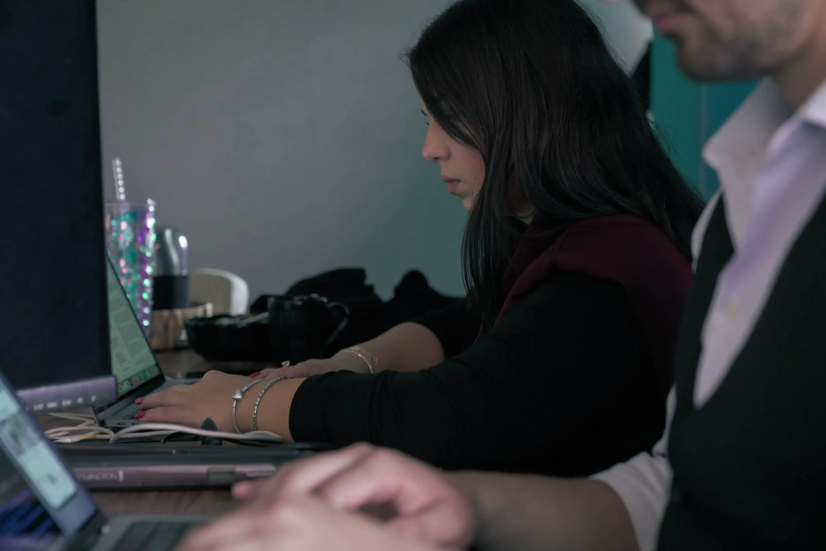 Developer working on iOS app code at the Neon Apps office
