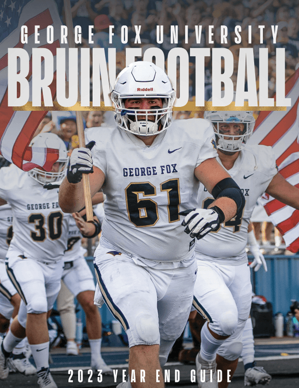 Modern home office setup with a monitor, ergonomic chair, keyboard, and indoor plants near a window with blinds.