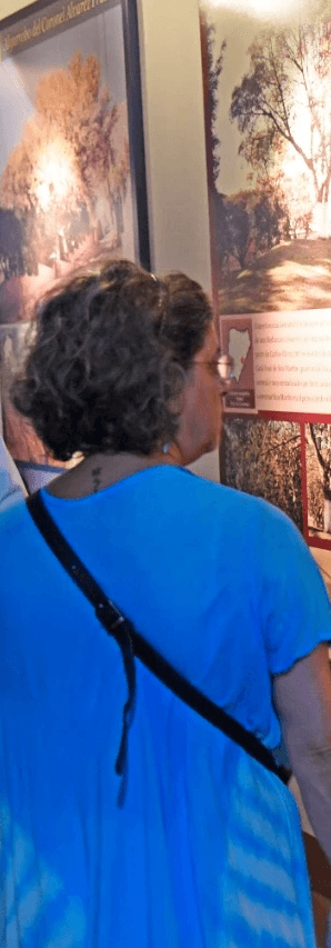 Portrait of a person in dark clothing speaking on a phone