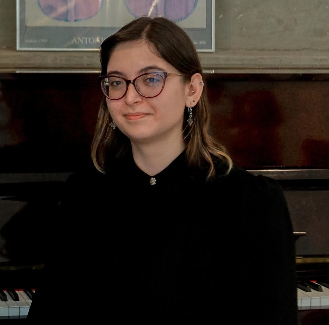 baby playing multicolored xylophone toy