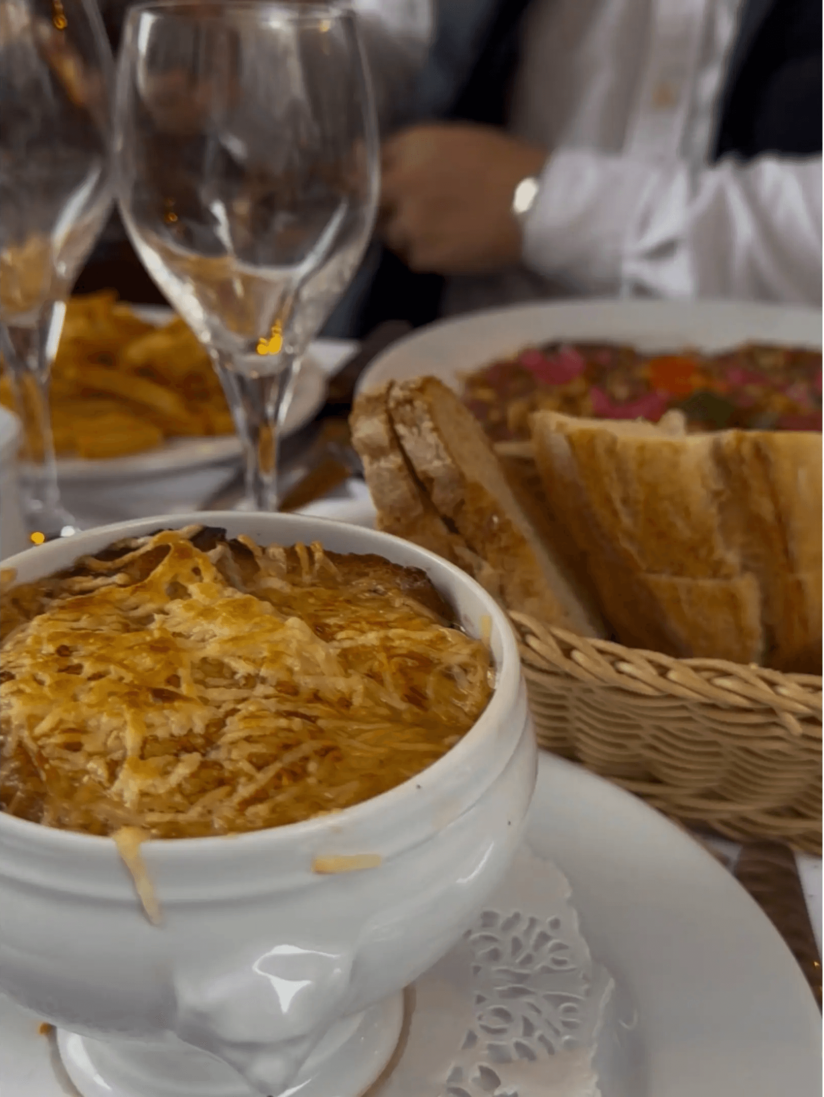 Traditional french onion soup in a Parisian bistro.