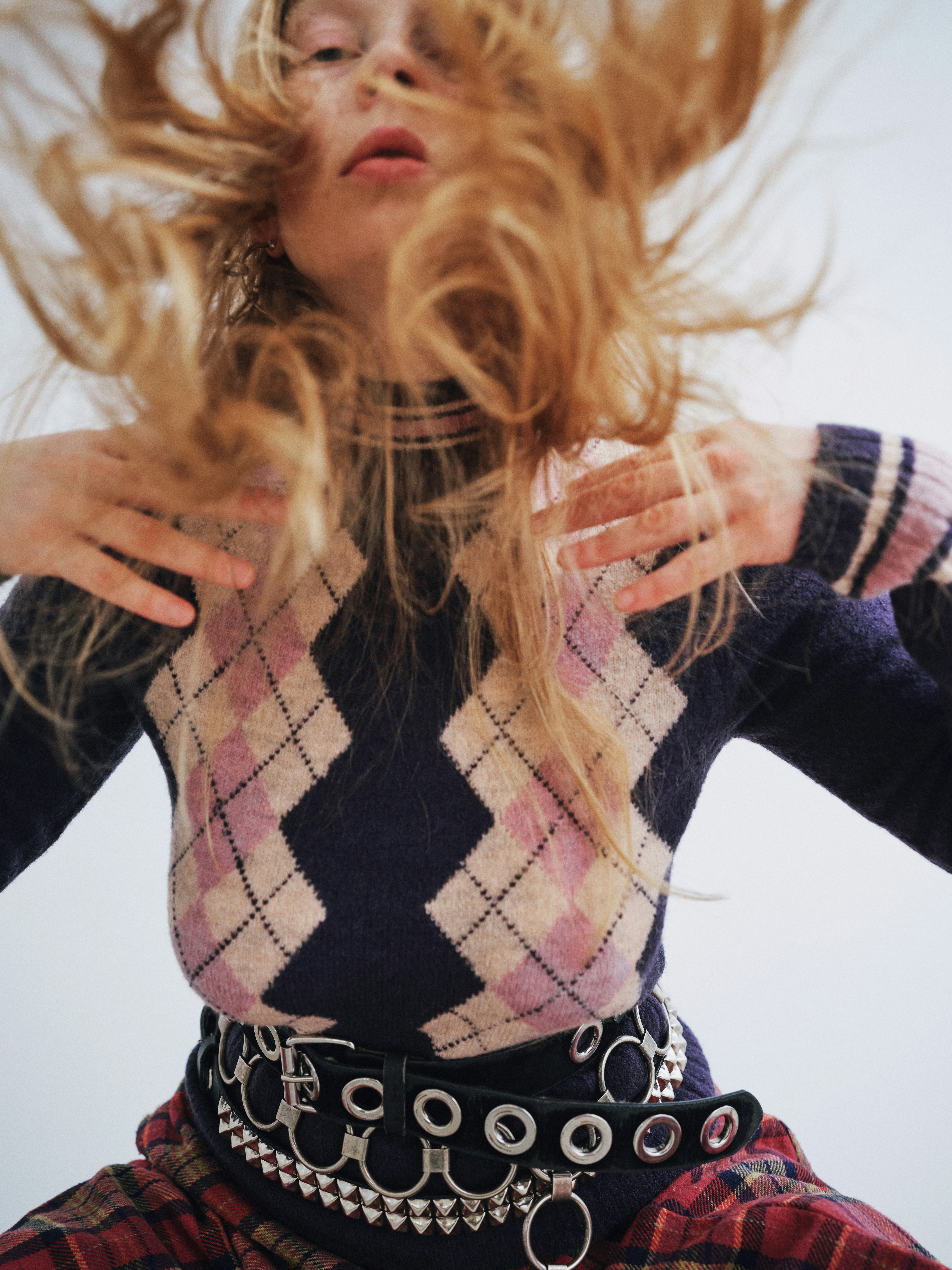 woman hovering over the camera with her hair open