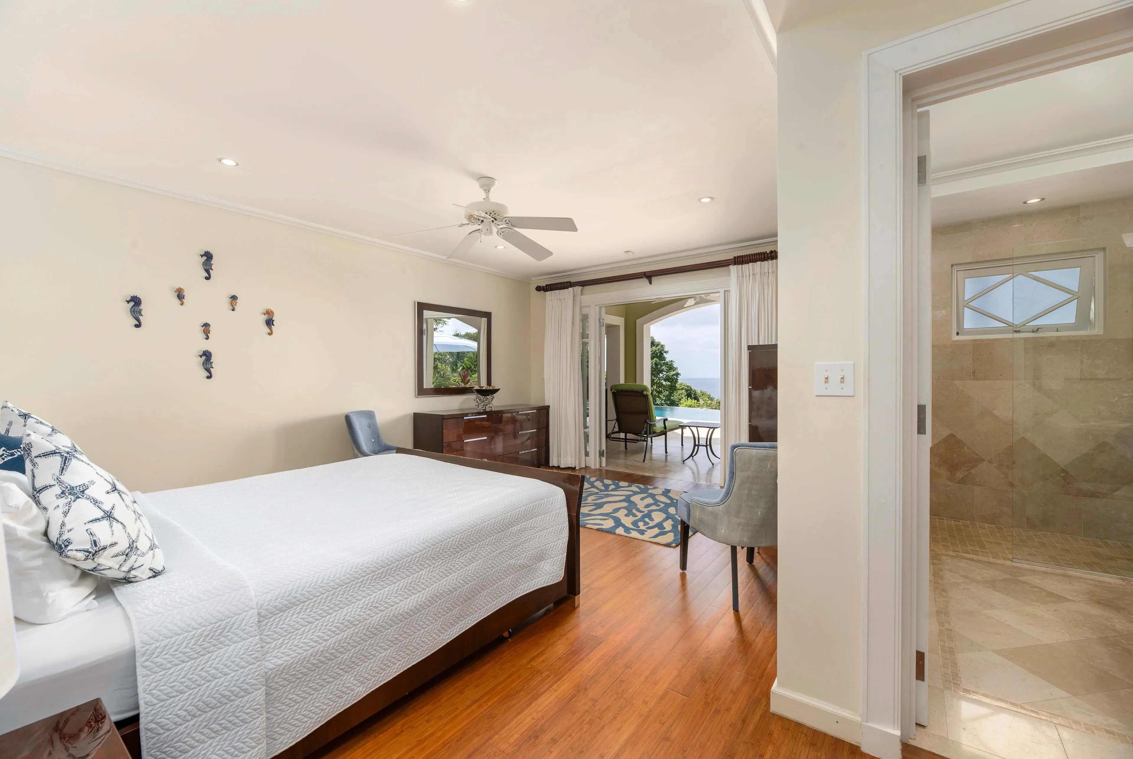 Bedroom with ensuite bathroom and warm lighting