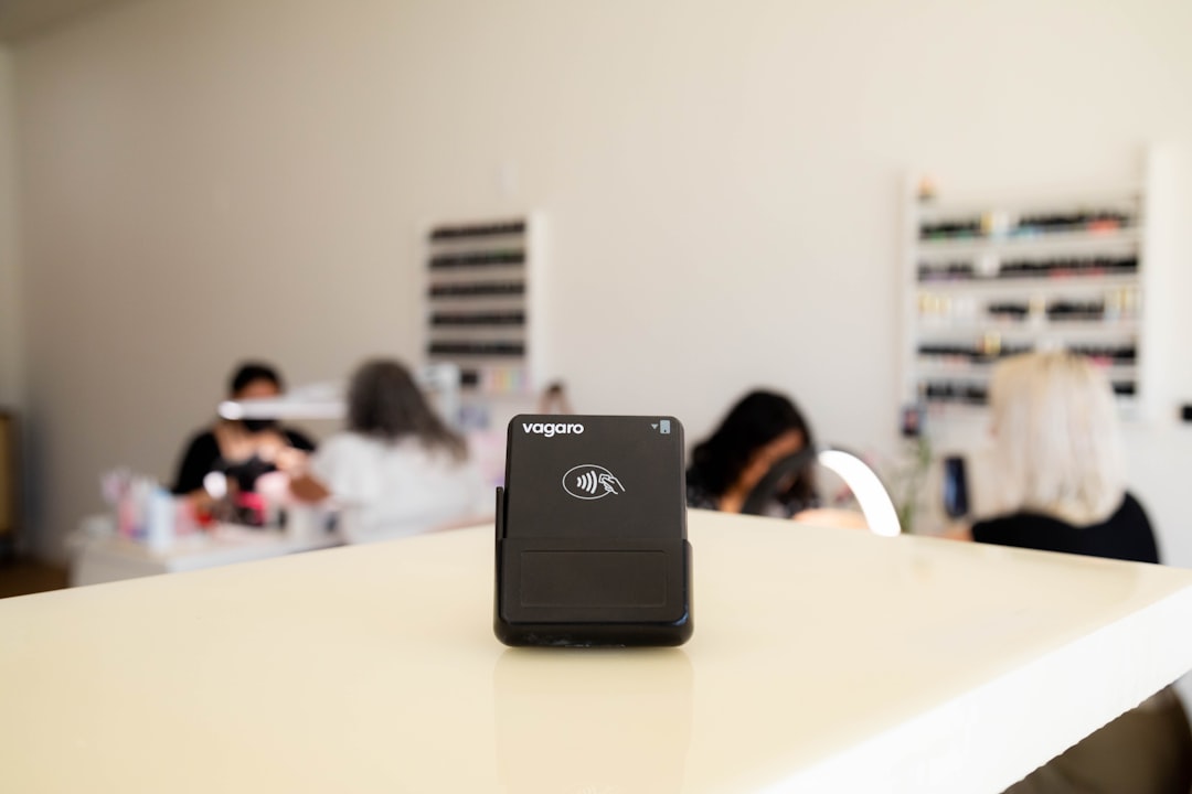 A card reader sits on a counter in a salon.