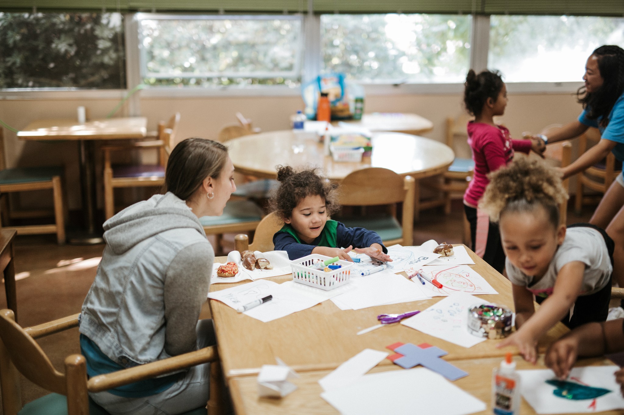 person sitting on grass and using phone