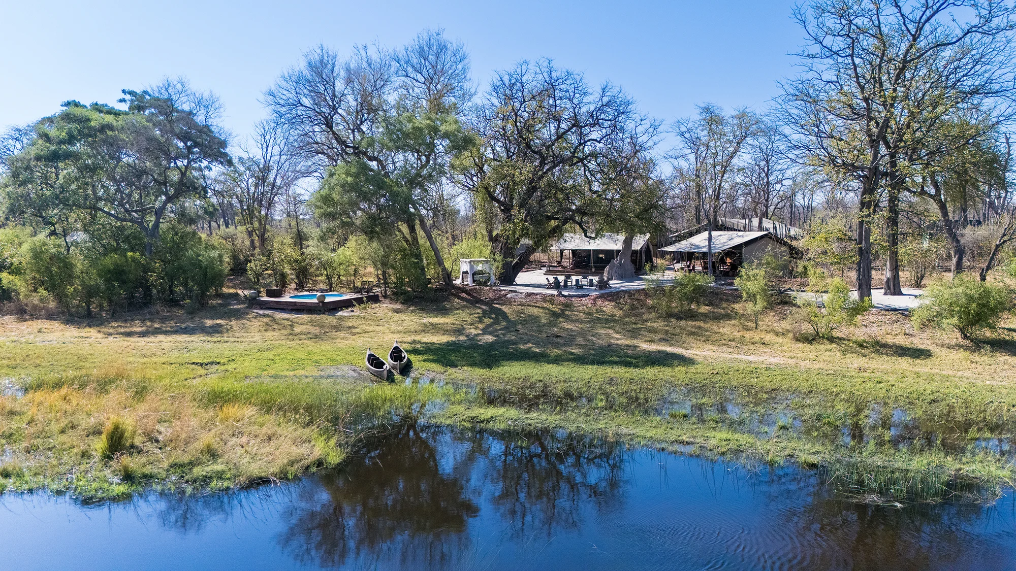 Selinda Explorers Camp set lightly among trees beside the Selinda Spillway in Botswana.