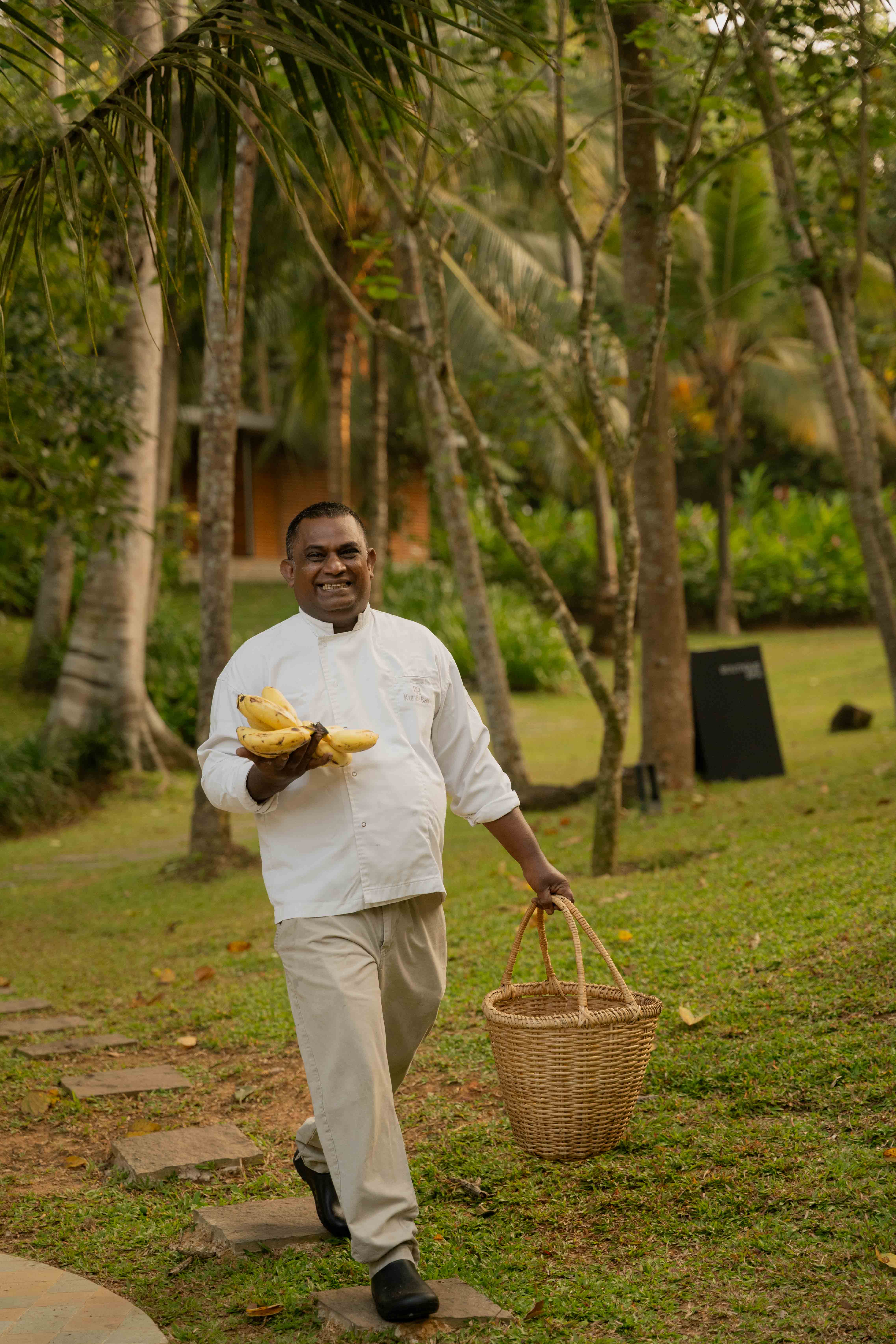 Cook carrying a basket on the way to the kitchen