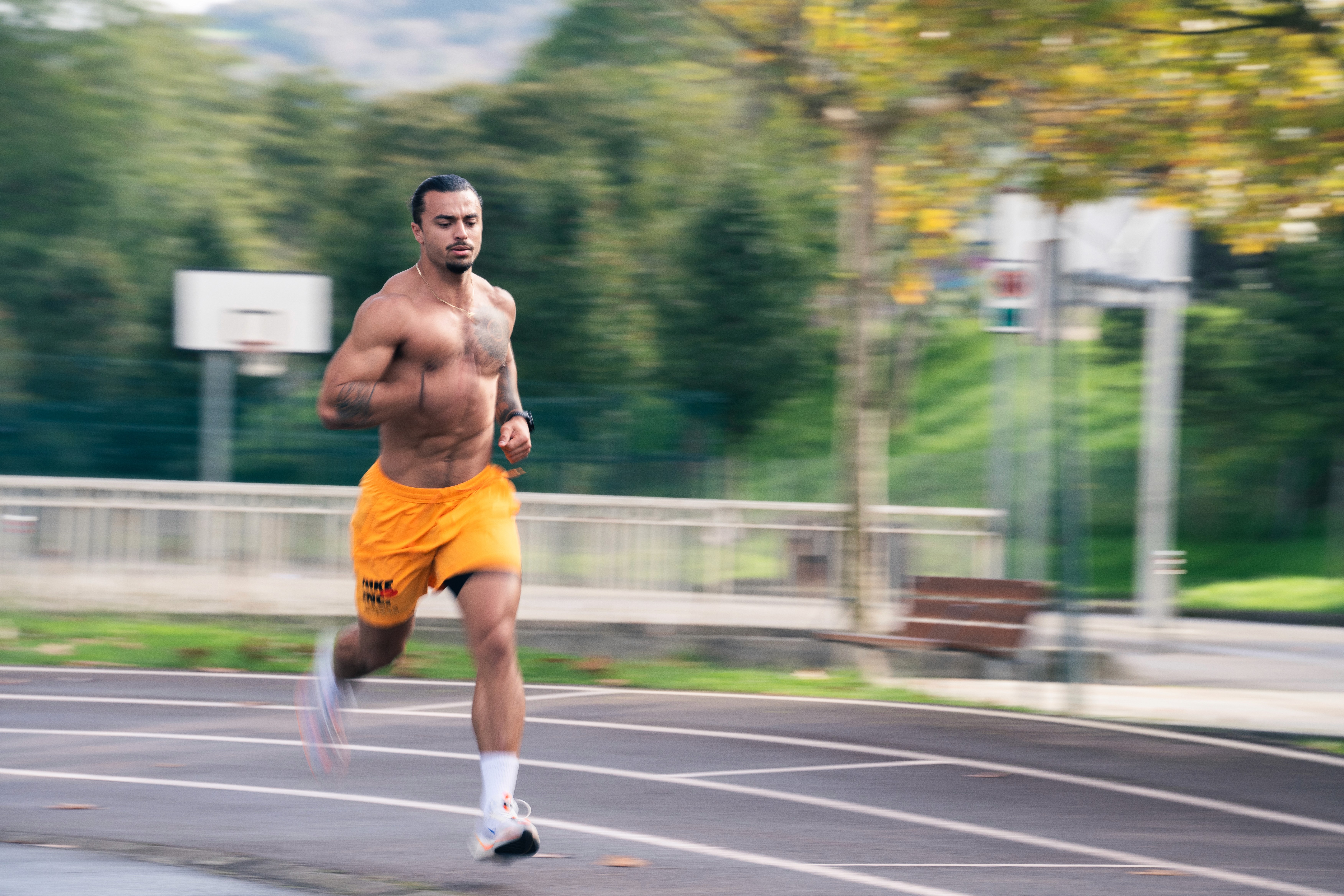 A man wearing a virtual reality headset, immersed in a digital experience, with a focused expression on her face.