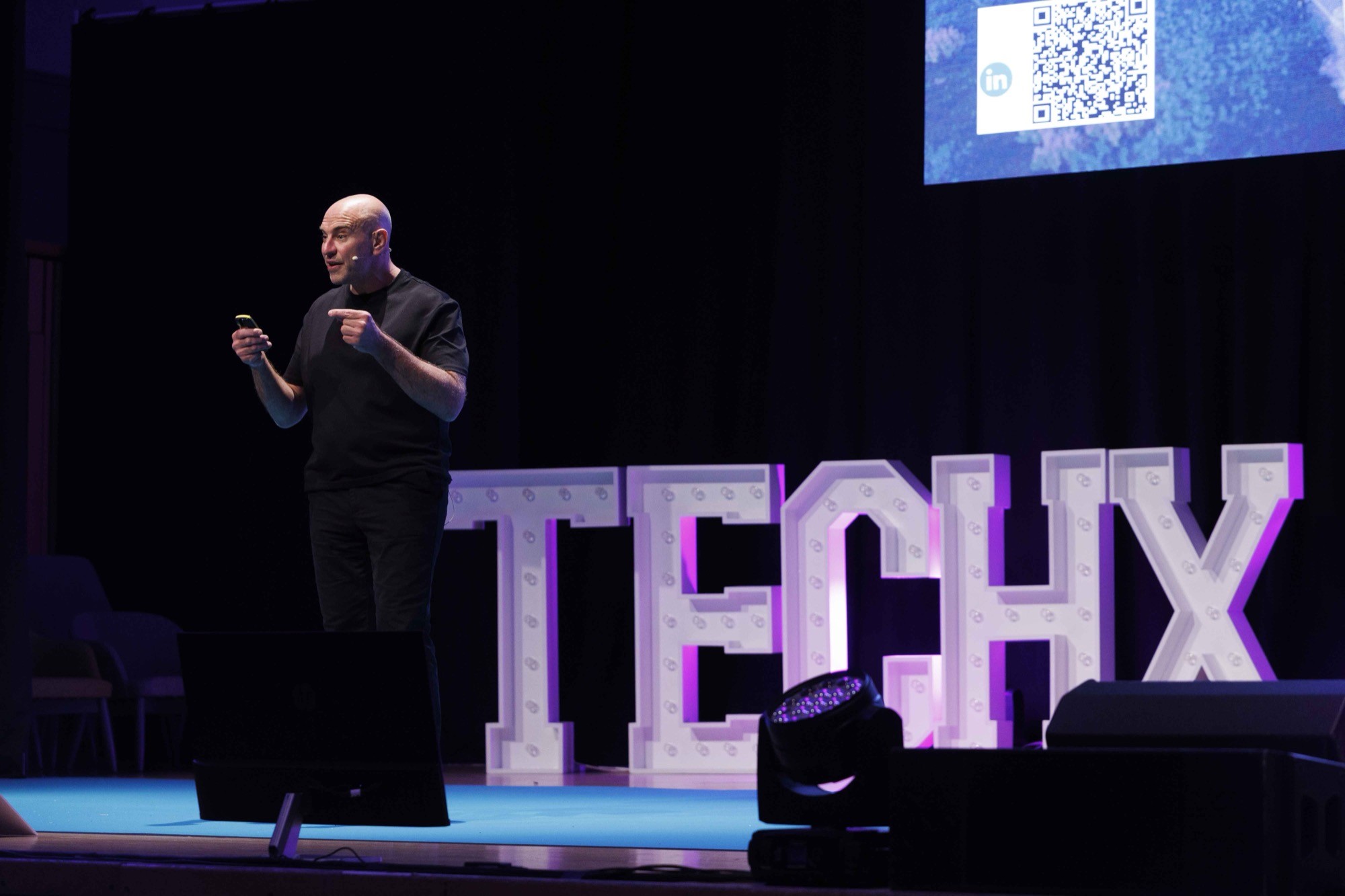 Aed Energy presenting on stage at TechX Demo Day