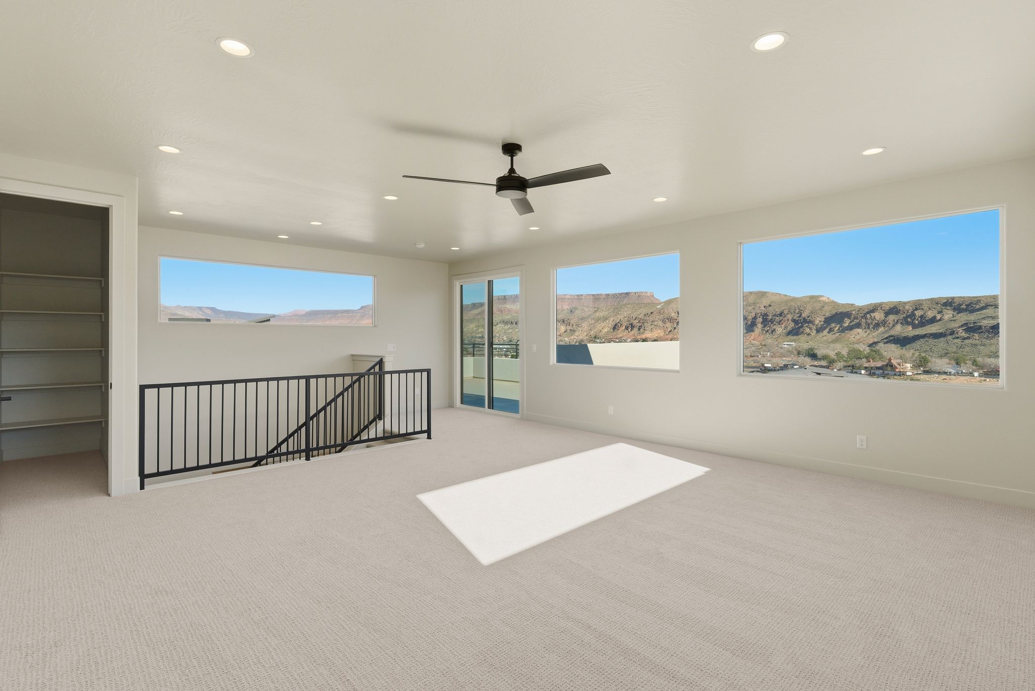 Upstairs flex space at The View at Falcon Ridge in Hurricane, Utah, offering built-in storage, versatile use, and views of the surrounding landscape.