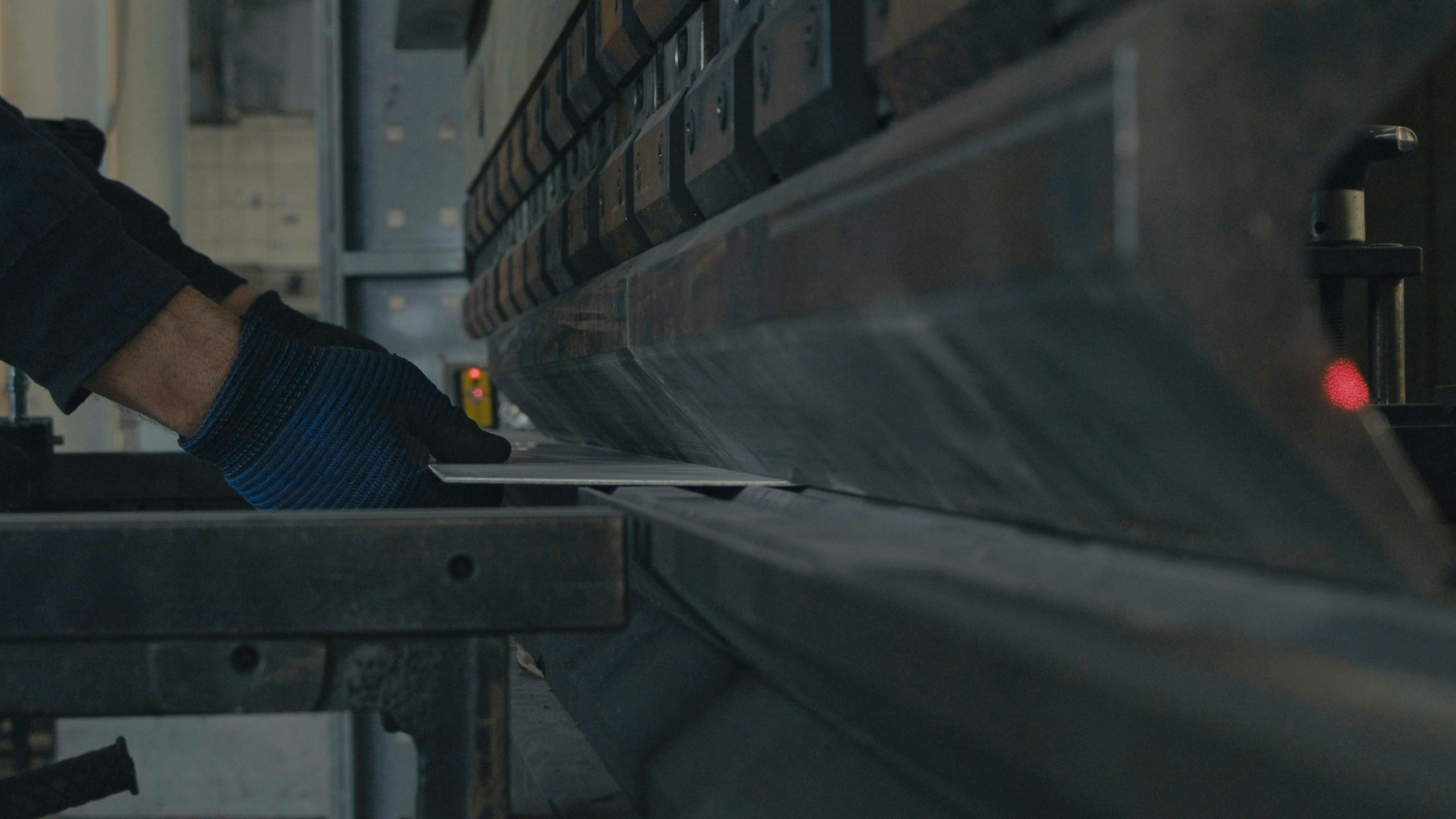 A man working on a machine in a factory