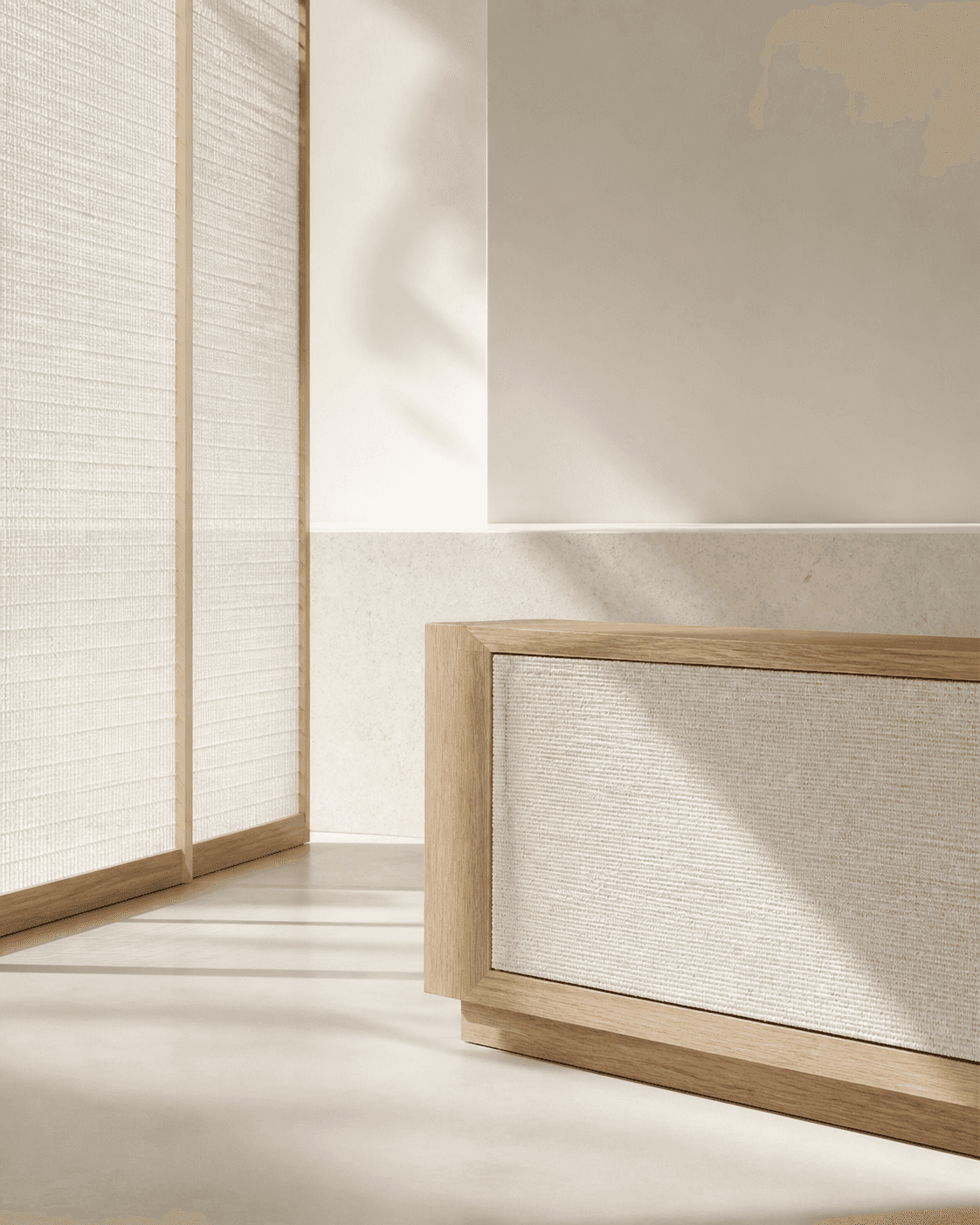 Pale-oak framed textile panels casting controlled shadows in a white interior