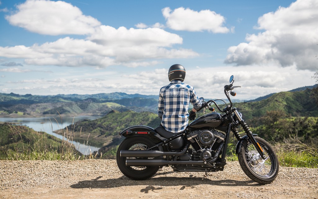 motorcycle rider sits on his motorcycle and views the landscape