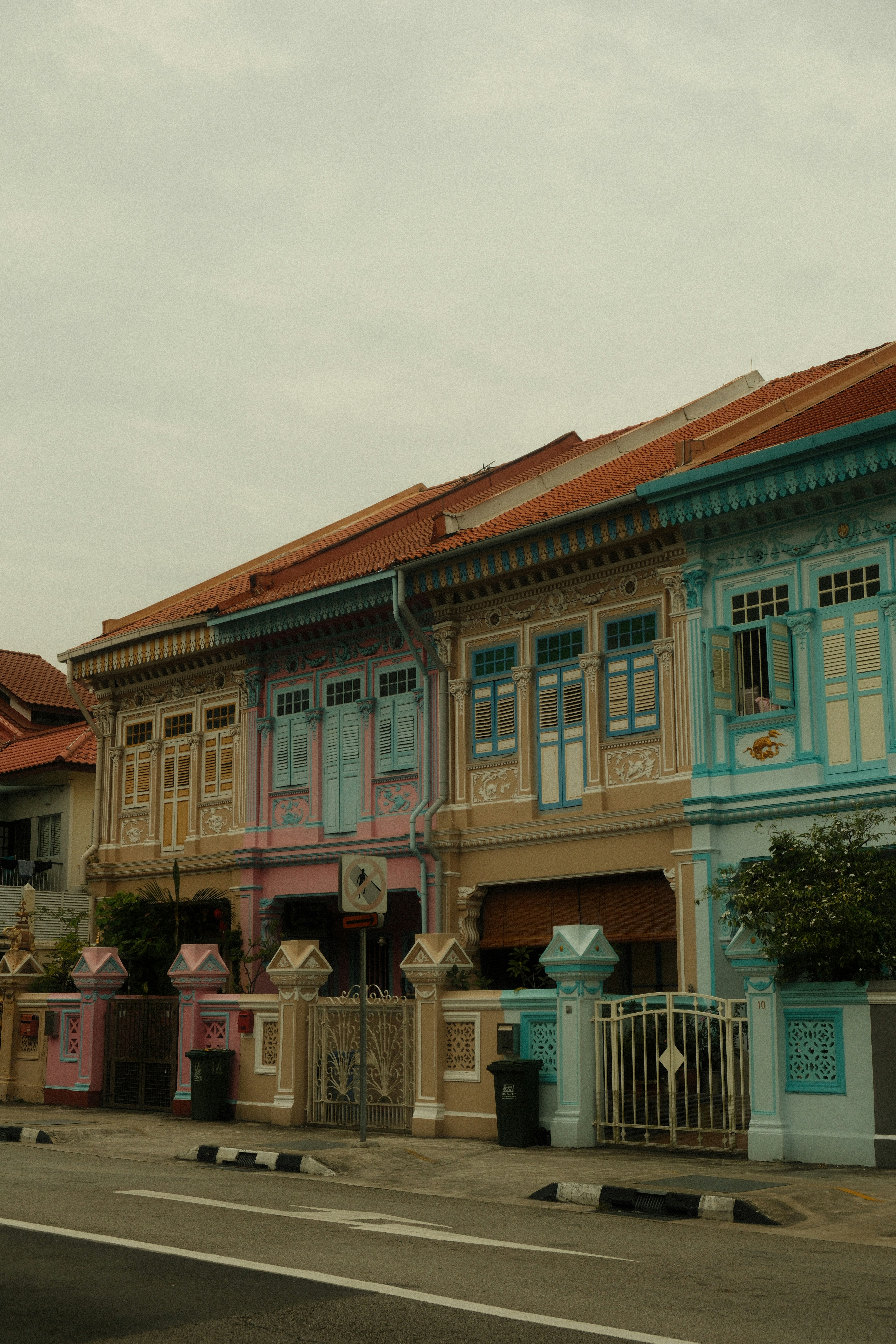 A row of colorful buildings on a street corner
