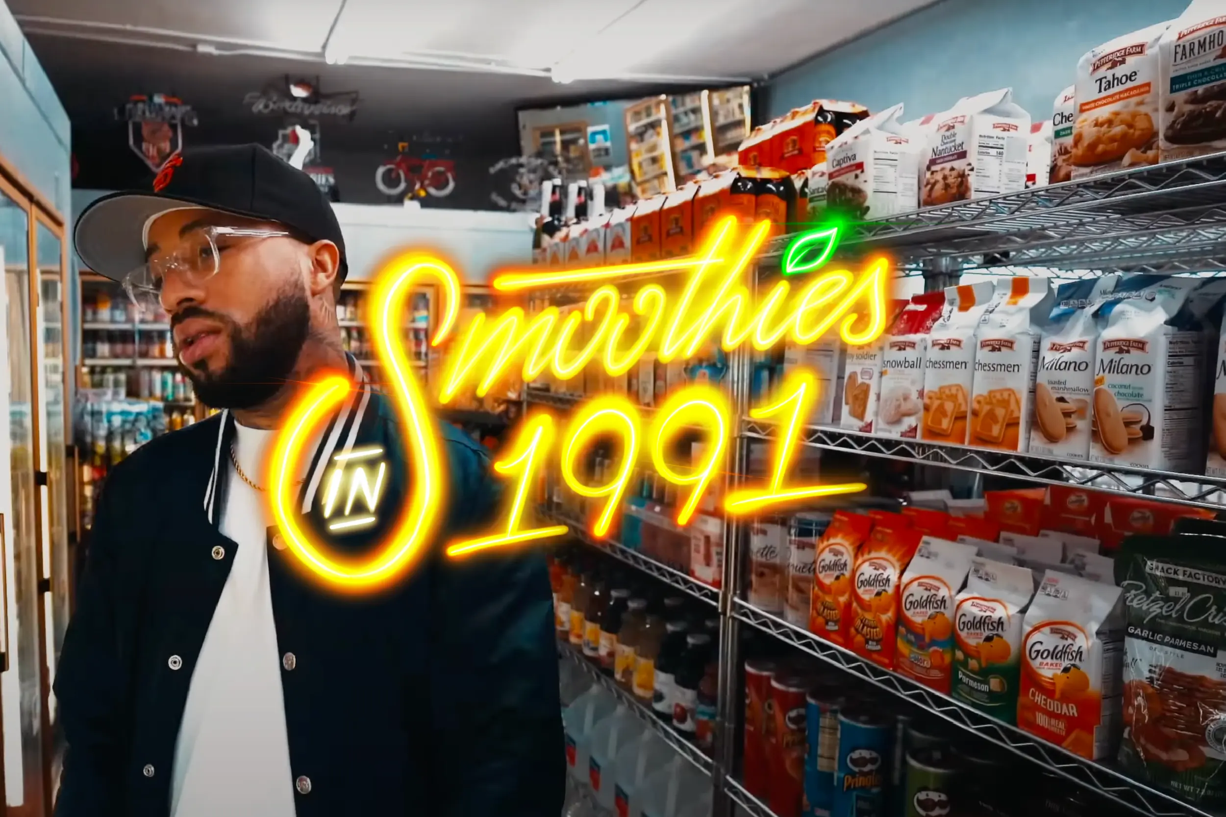Still frame from Larry June’s “Smoothies in 1991” music video with neon custom script font.
