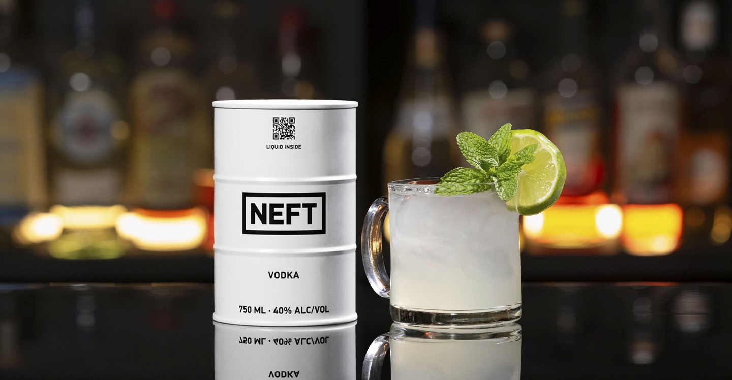 A NEFT Barrel and a glass of Austrian Mule on a bar counter.