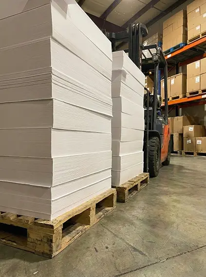 Sarpac factory warehouse in Kuching with ready-stock paper inventory for fast production.