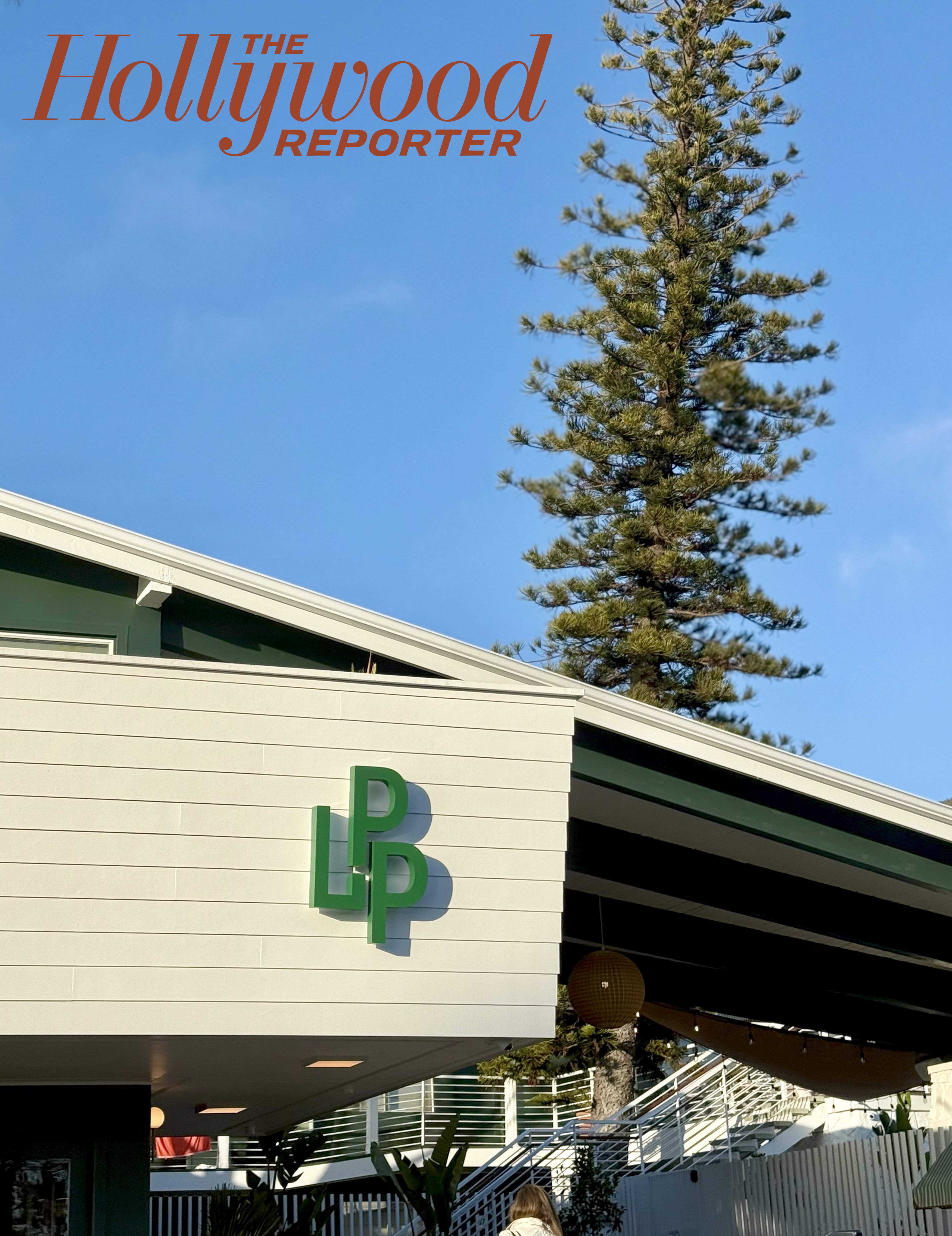 Boutique Hotel in California with mid-century design and tall tree in the background