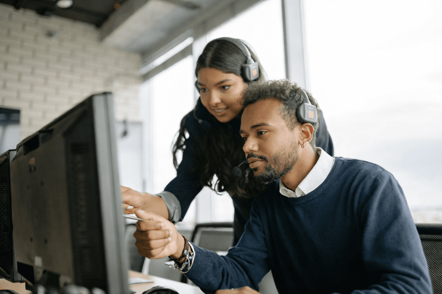 A small business handshake symbolizes customer engagement with affordable business phone systems, AI virtual receptionist, projects, and communications.