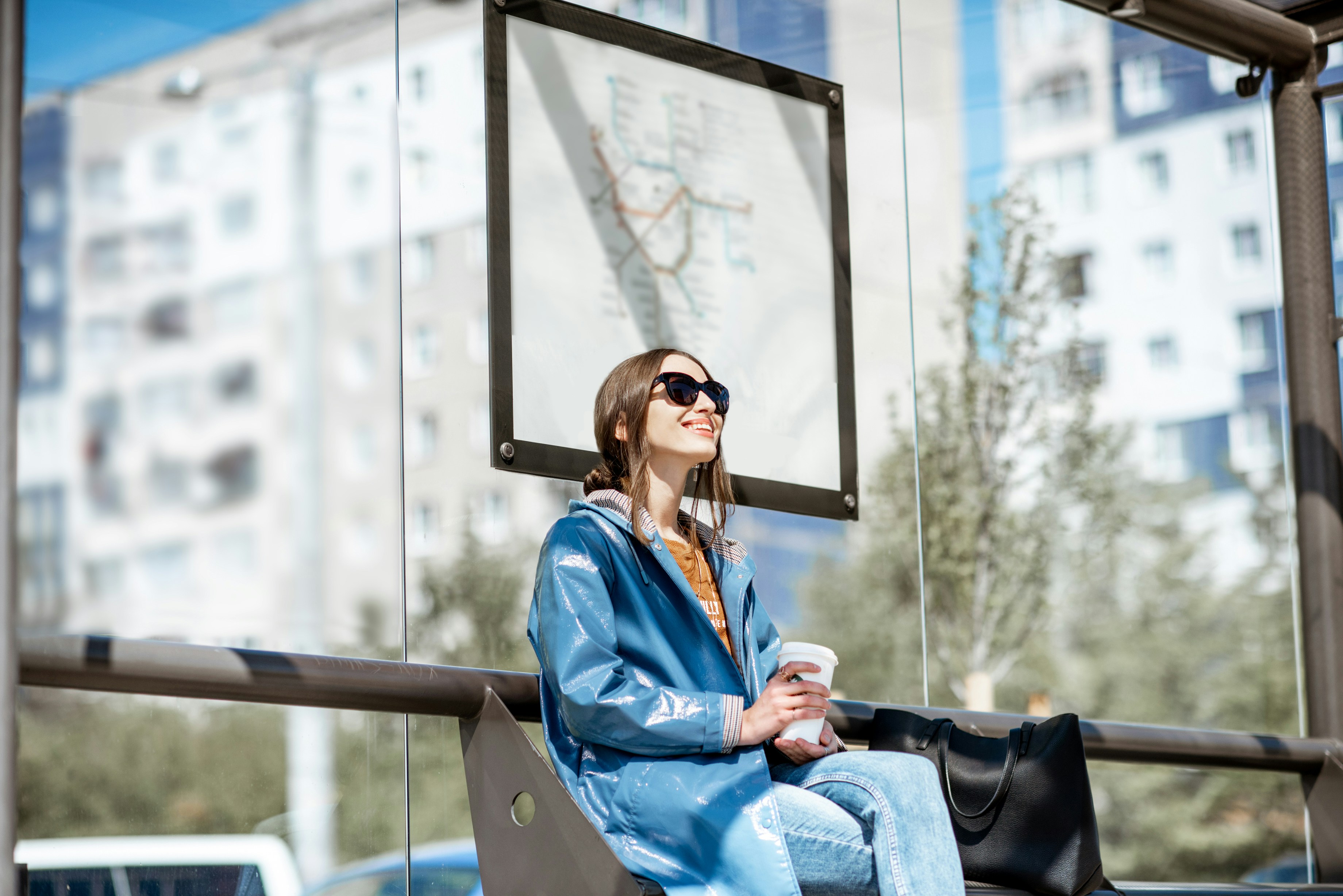 Woman waiting at bus stop