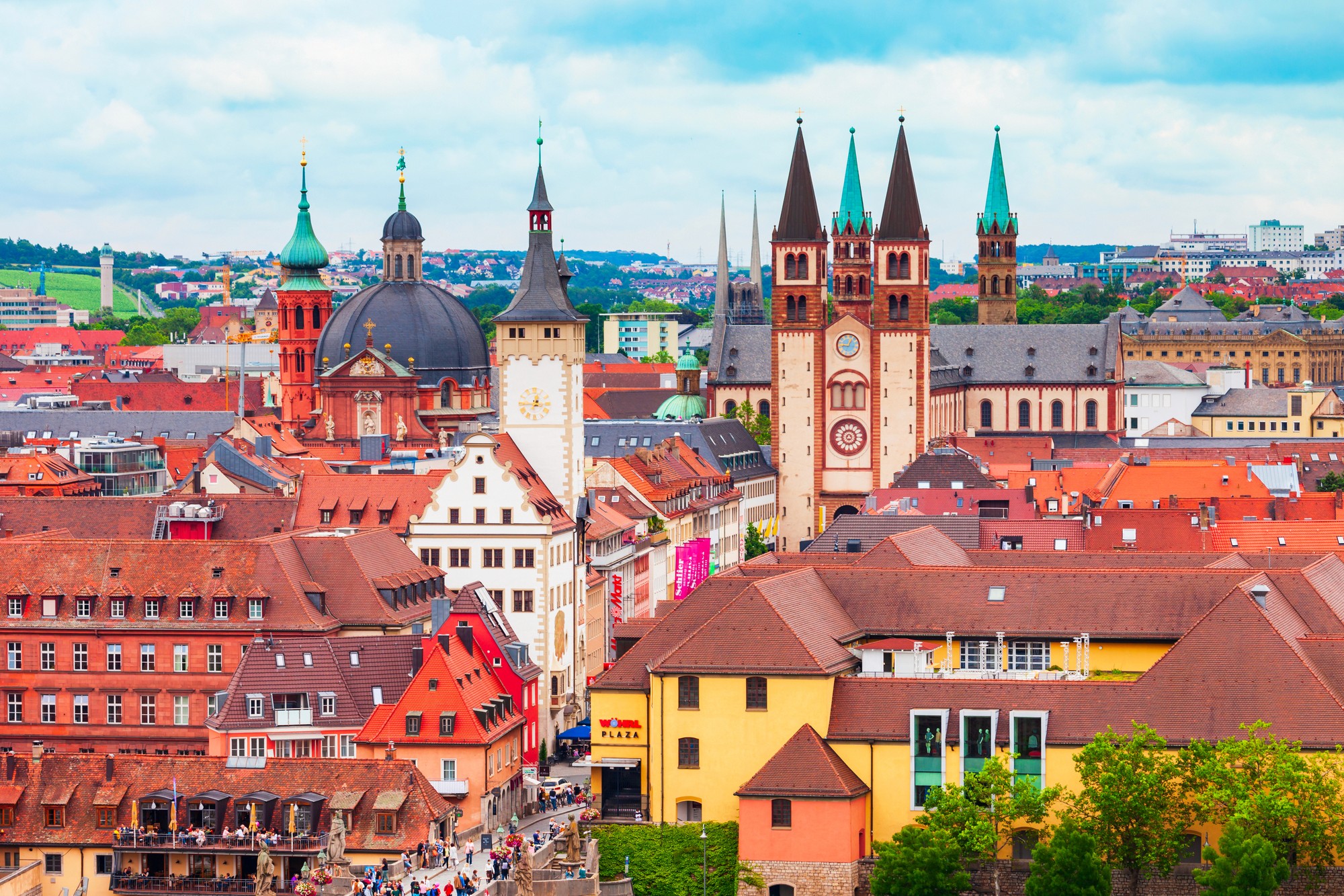 a beach with palm trees and a boat in the water