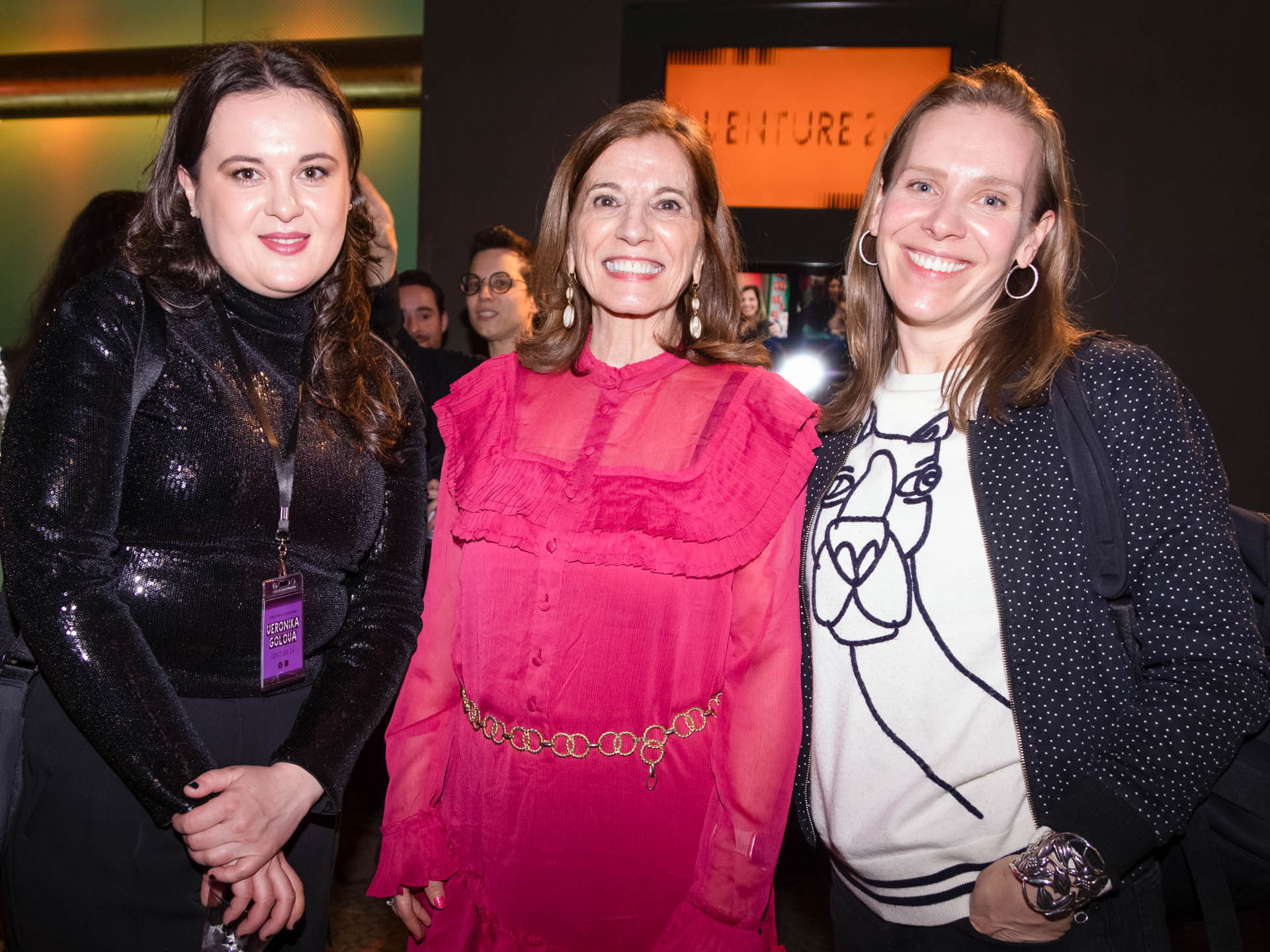 a group of students smiling for the camera in the SVA Theatre lobby after the Venture Forum
