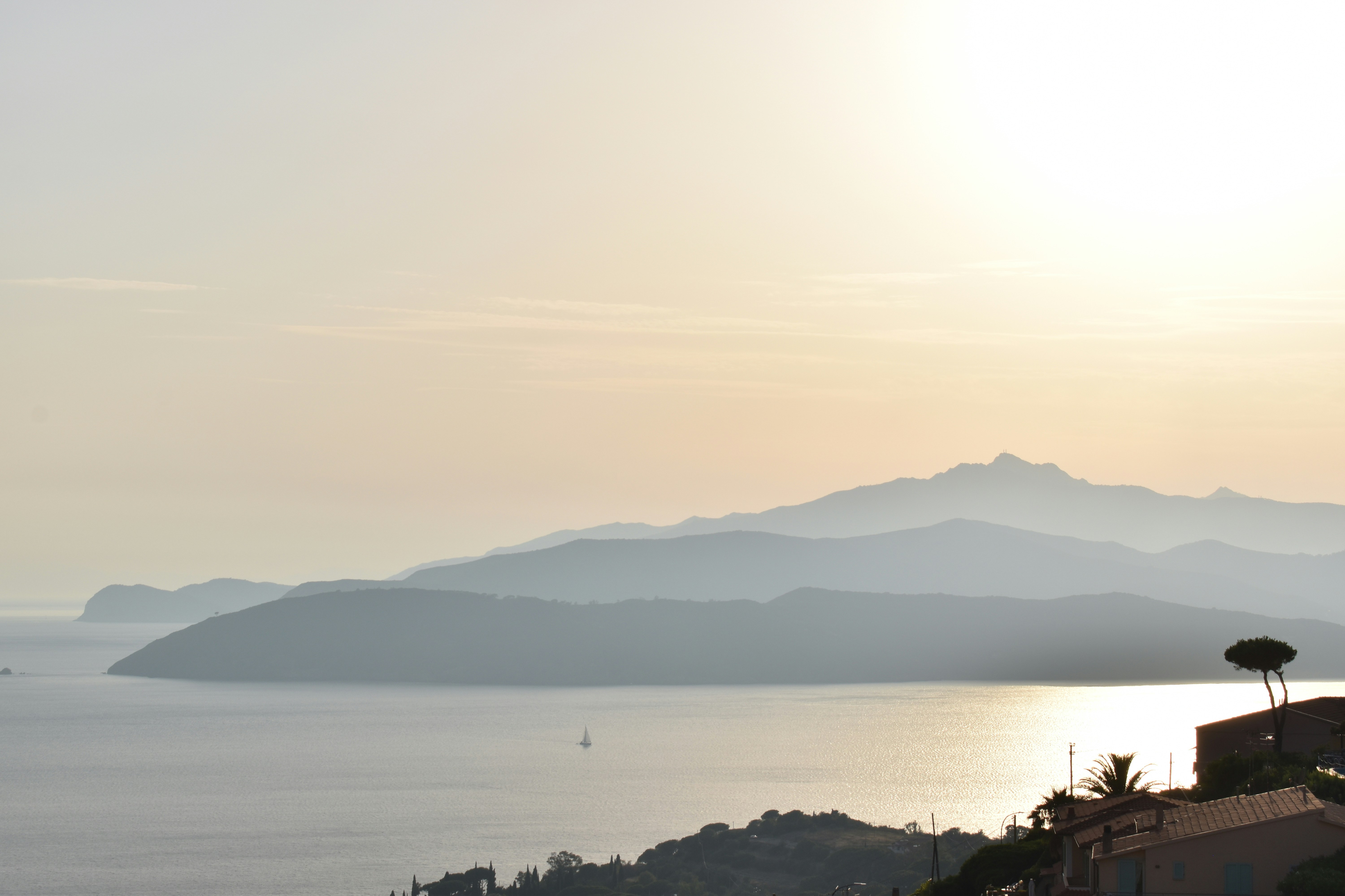 A view of a body of water with mountains in the background