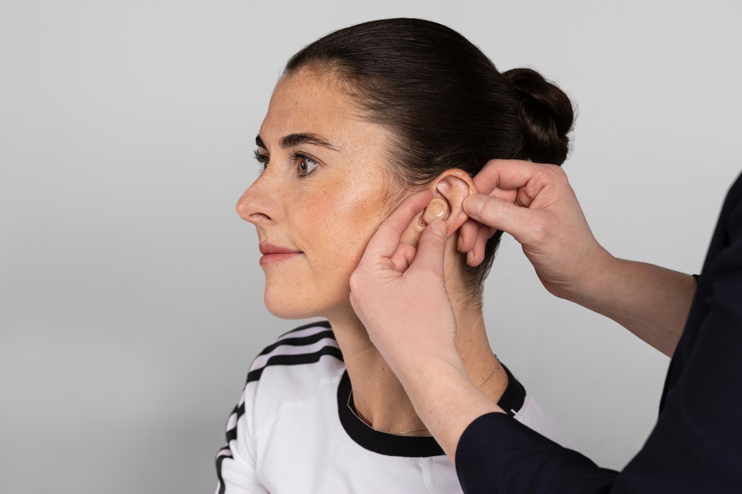 A woman havign her ears checked.