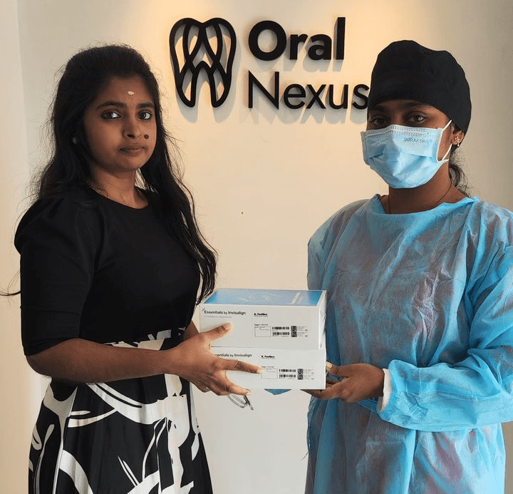 Person with auburn hair in black coat and turtleneck