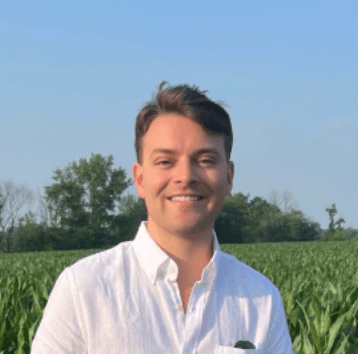 A happy customer smiling wearing orange headband