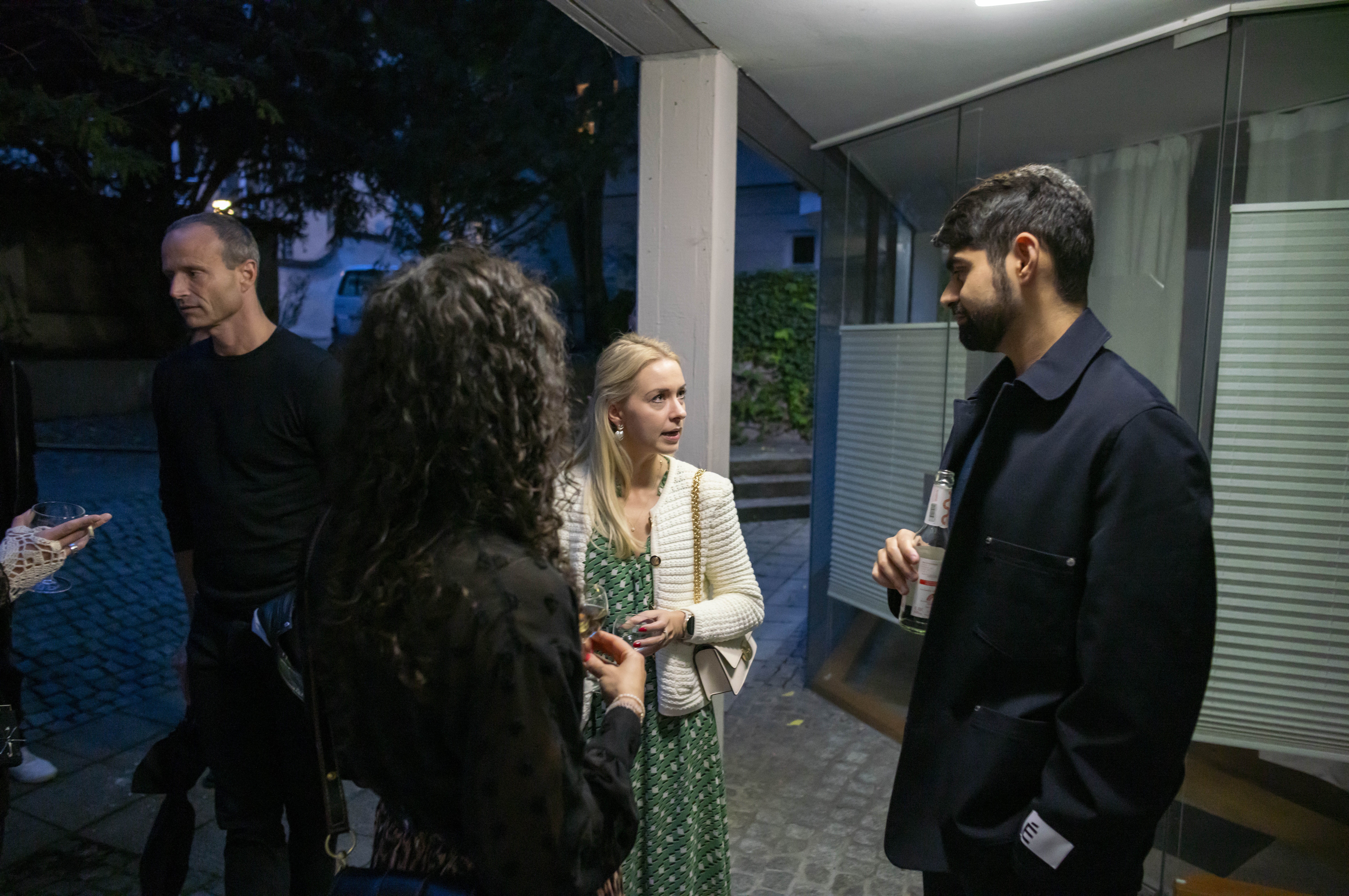 Entrepreneurs engaging in a lively discussion during a Bizz Buzz networking event.
