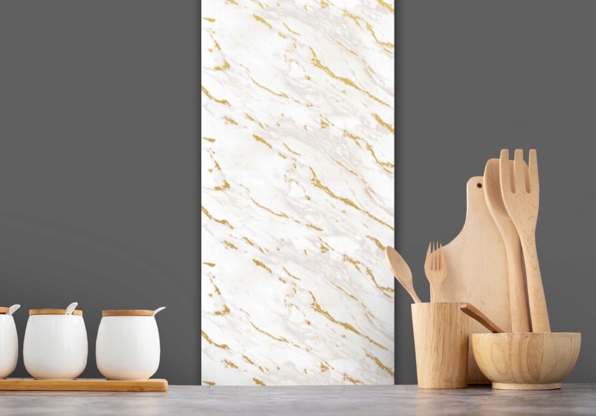 a glass of cocktail with a slime orange fruit