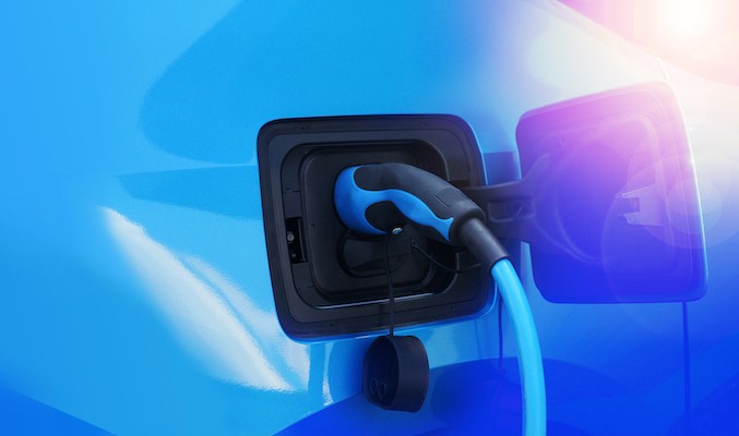 An EV charger plugged into a vehicle