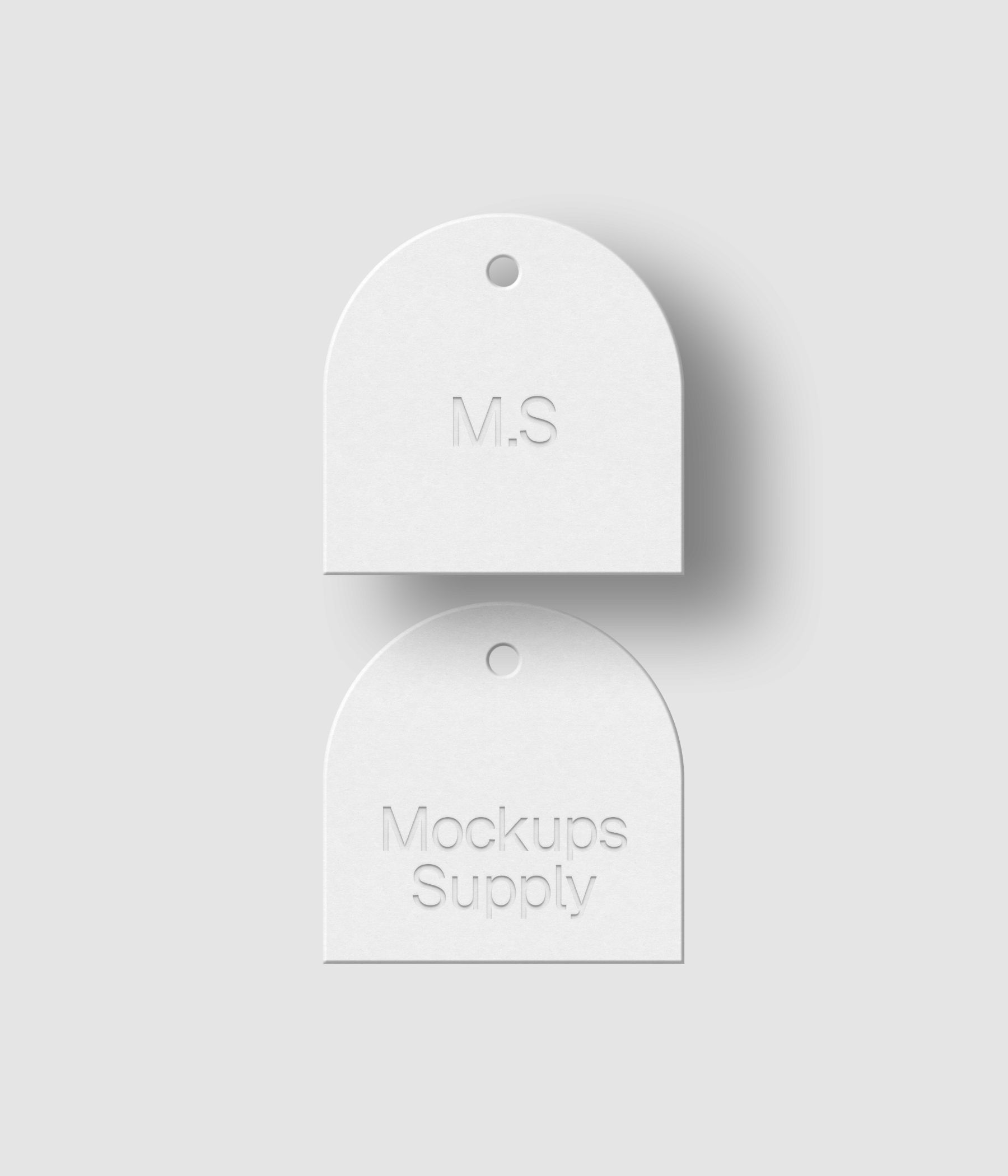 Two white arch hang tags 1x1 square ratio with debossed text effect and editable shadow on black background photoshop PSD mockup