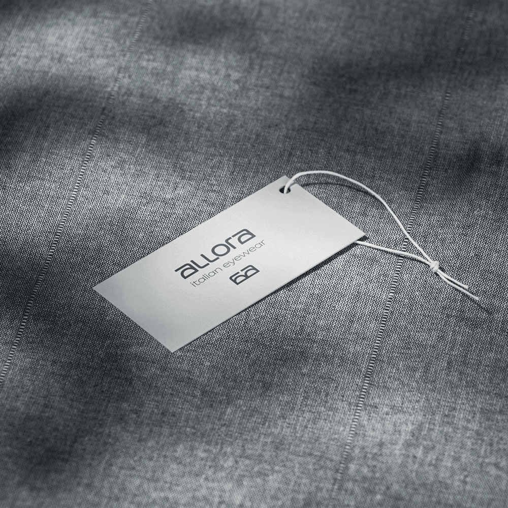 Branded hang tag mockup highlighting the clean typography and refined fashion identity.