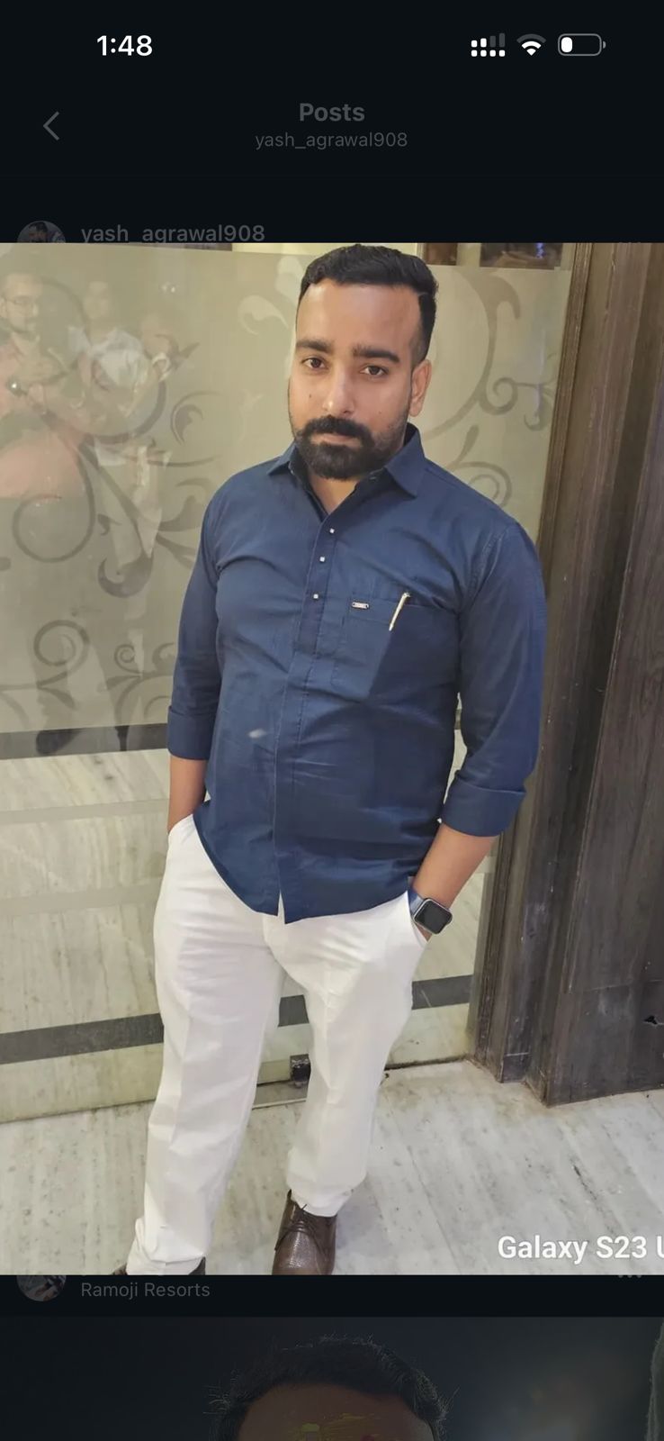 a man in a white shirt and black jacket