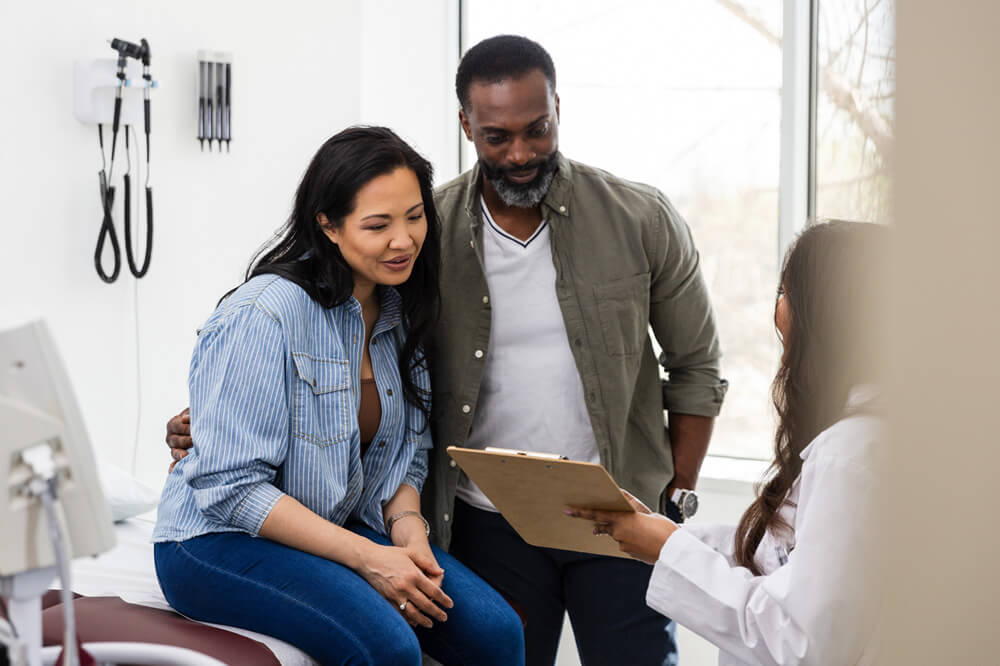 couple looking at clipboard