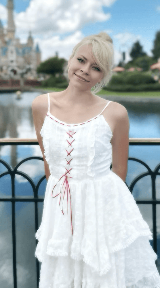 A smilintg girl holding books