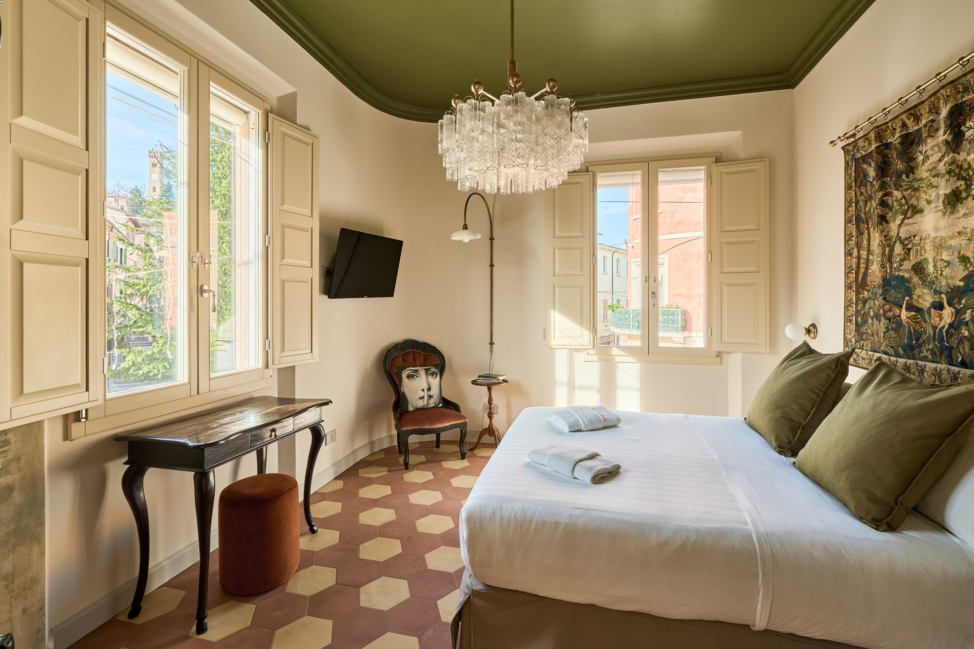 A wooden essential oil diffuser emitting a gentle mist, surrounded by small bottles of essential oils and dried herbs. The soft lighting enhances the cozy and therapeutic setting.