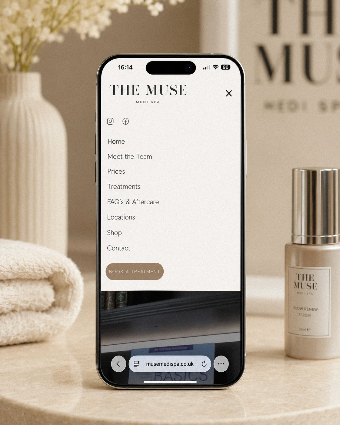 Website menu on a phone screen with spa branding.