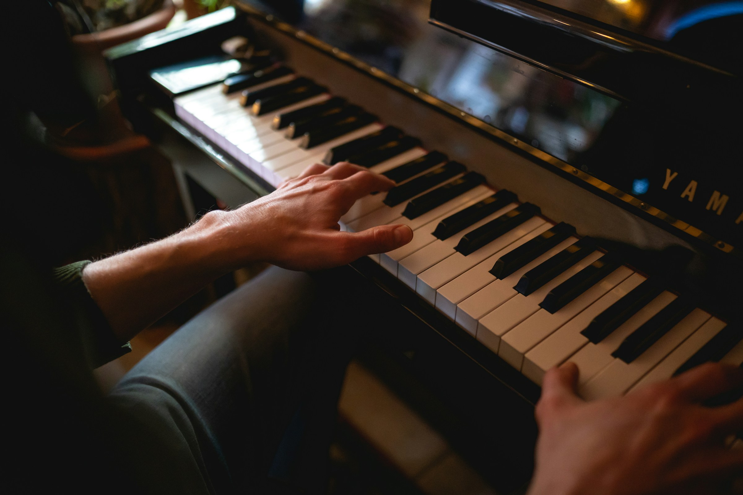 man playing piano - How to Read Piano Sheet Music
