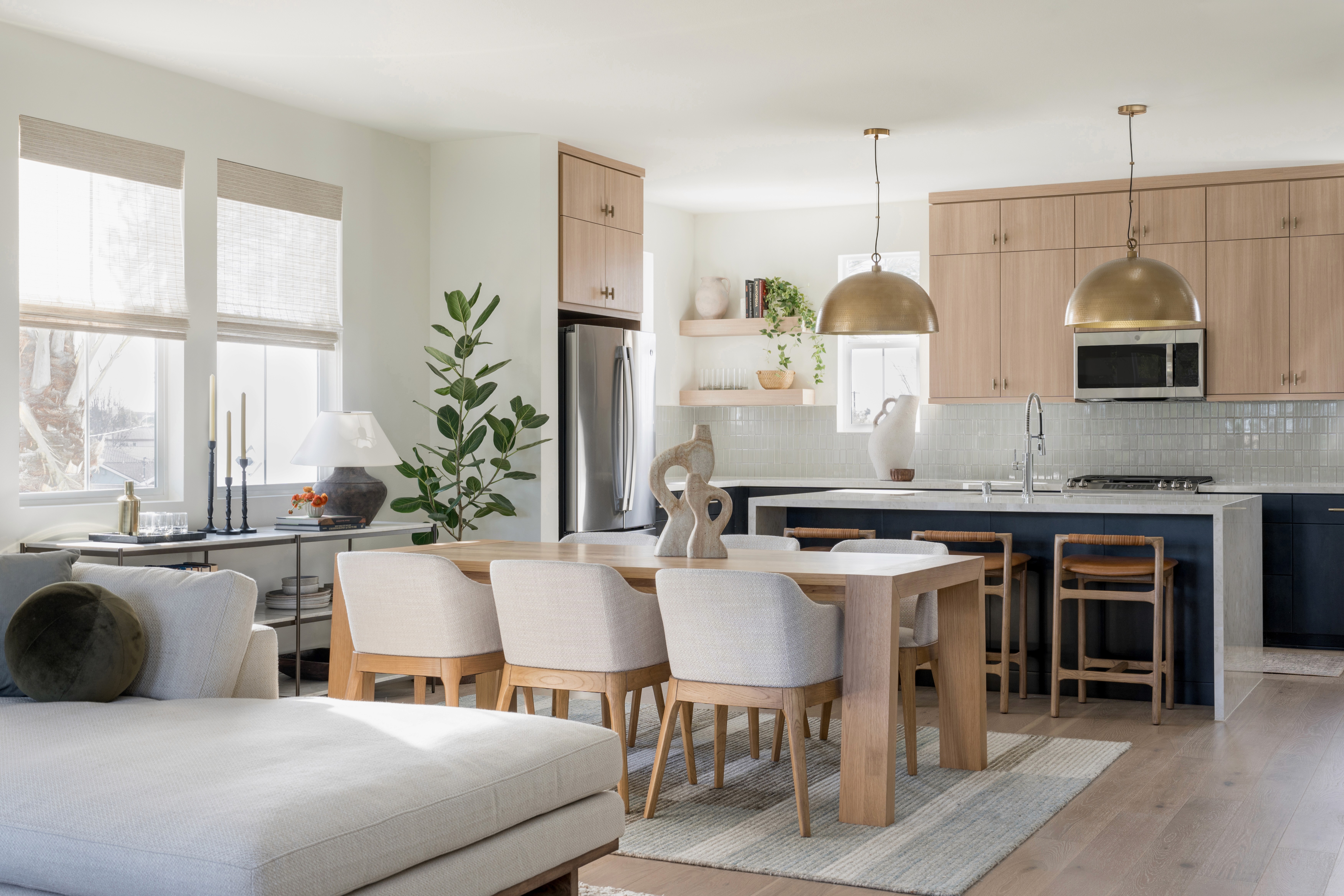 View of open concept living area leading into dining area and kitchen