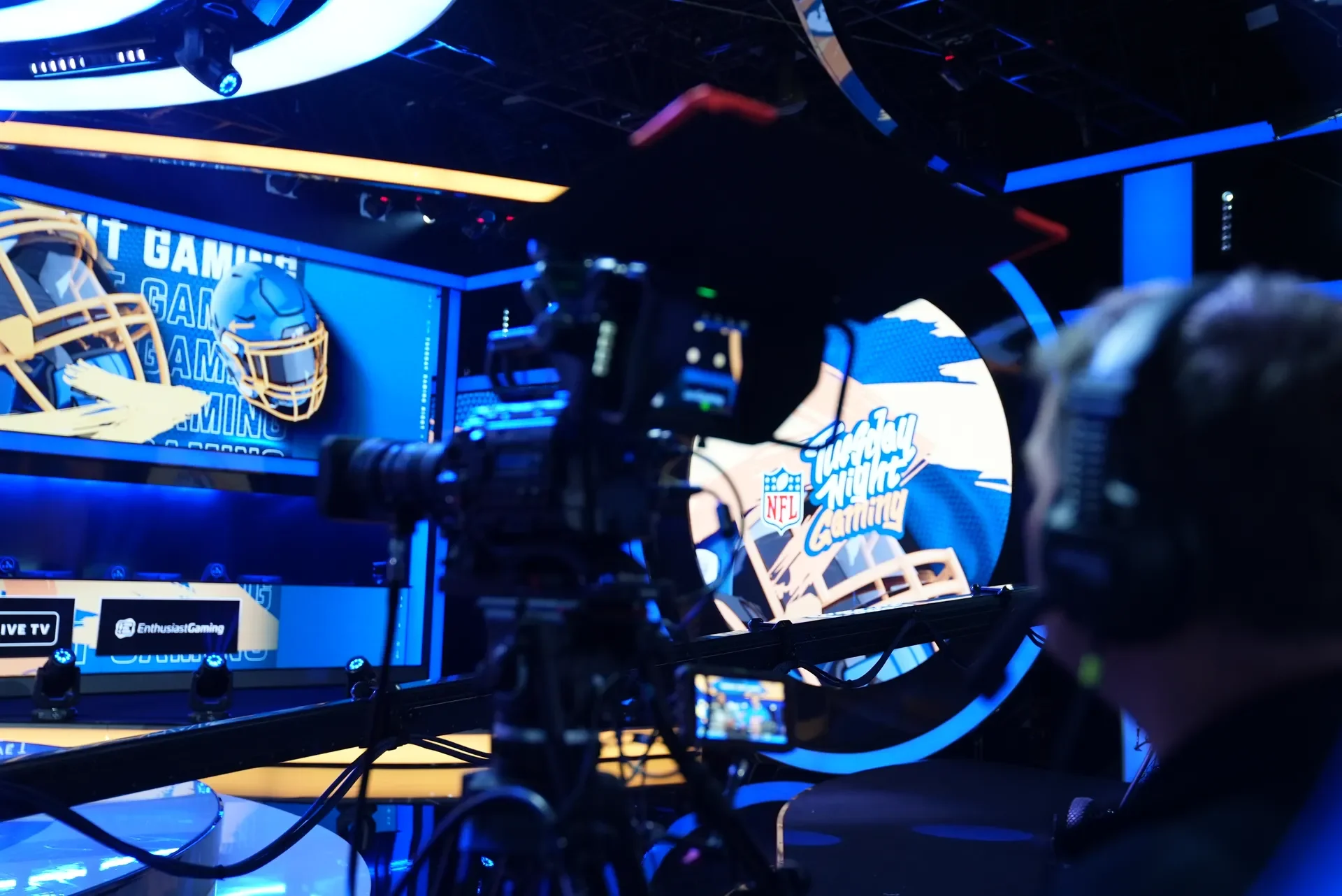 A studio camera frames the Tuesday Night Gaming set, with the show's logo on screen