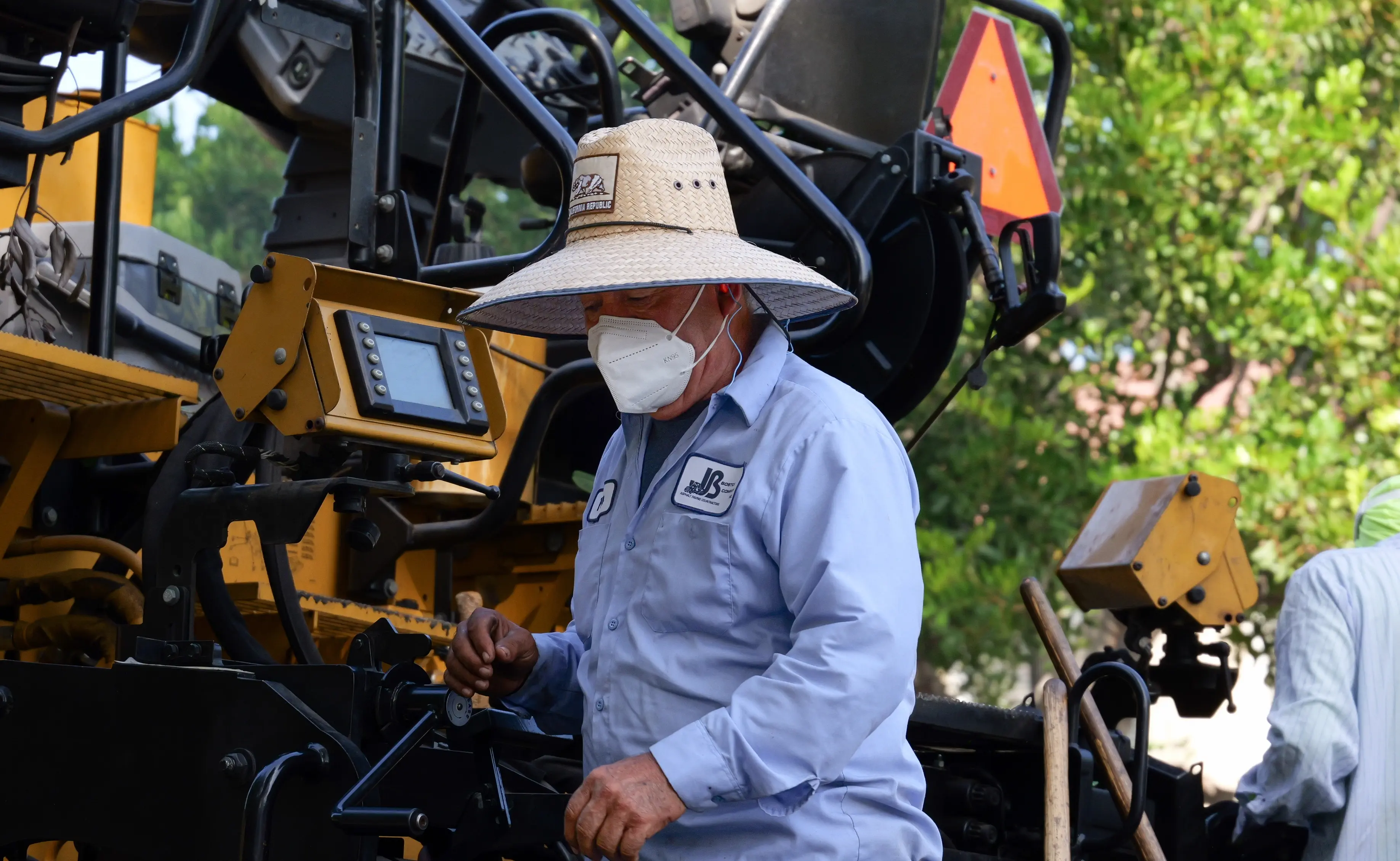 Closeup photo of asphalt crew worker on project