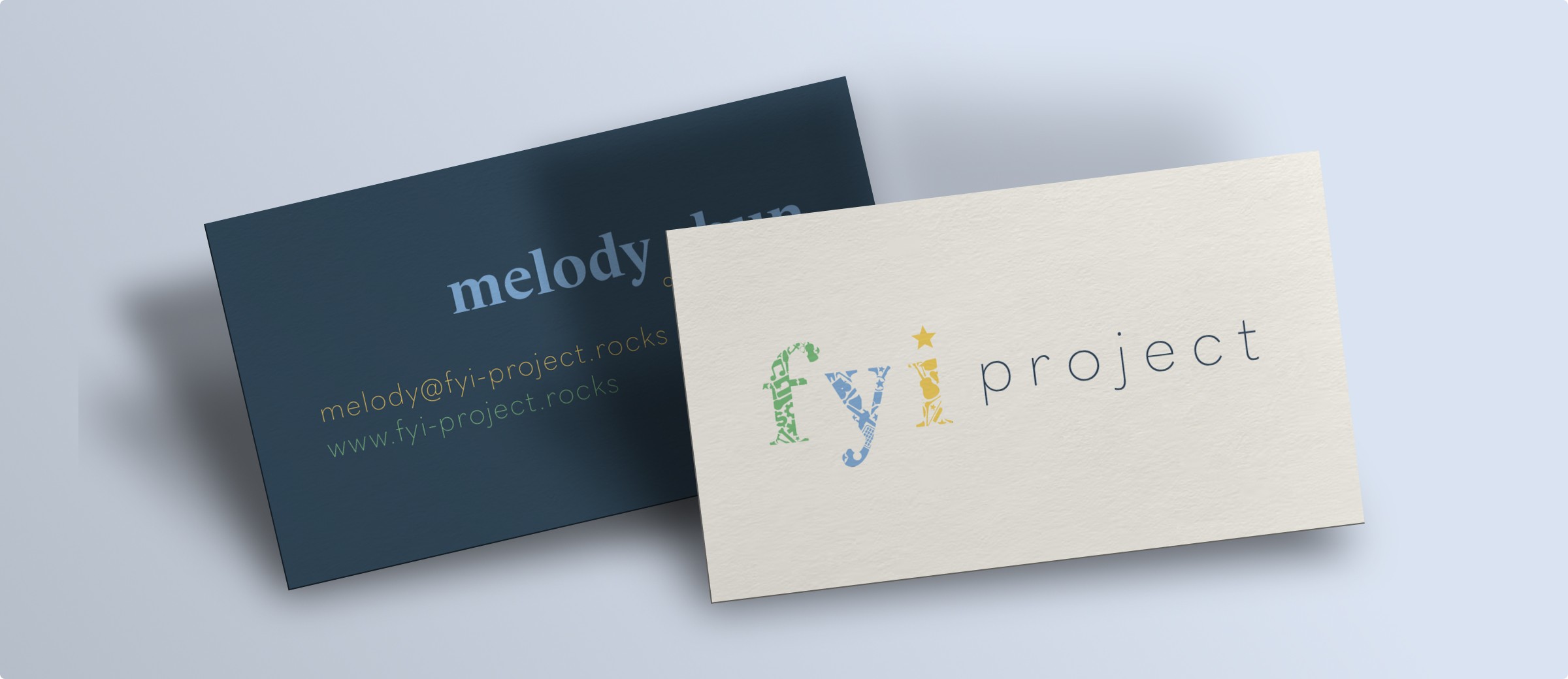 2 business cards, one showing the dark blue back with details and the other showing the lighter front side with logo.