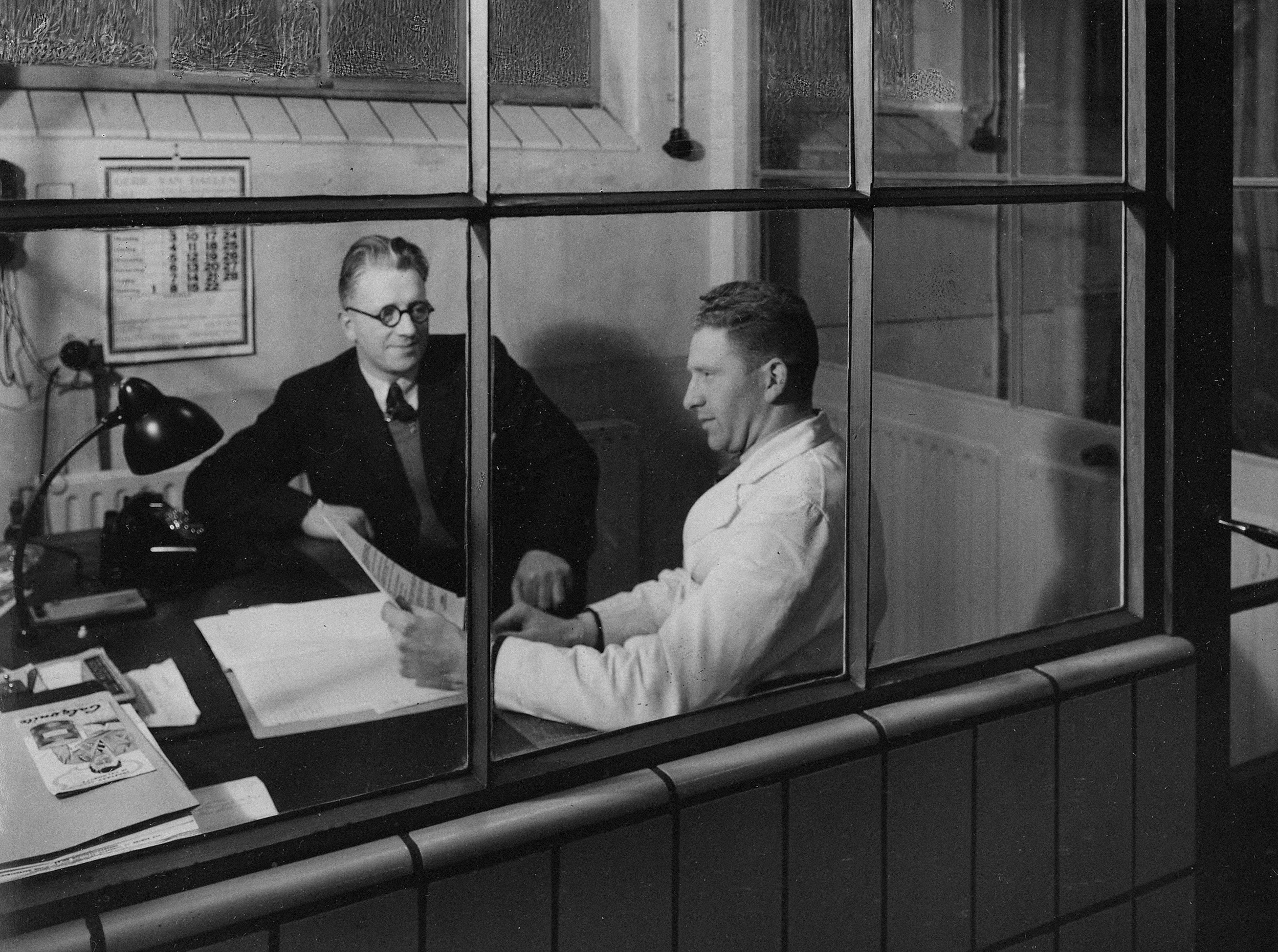 two men working in a vintage office
