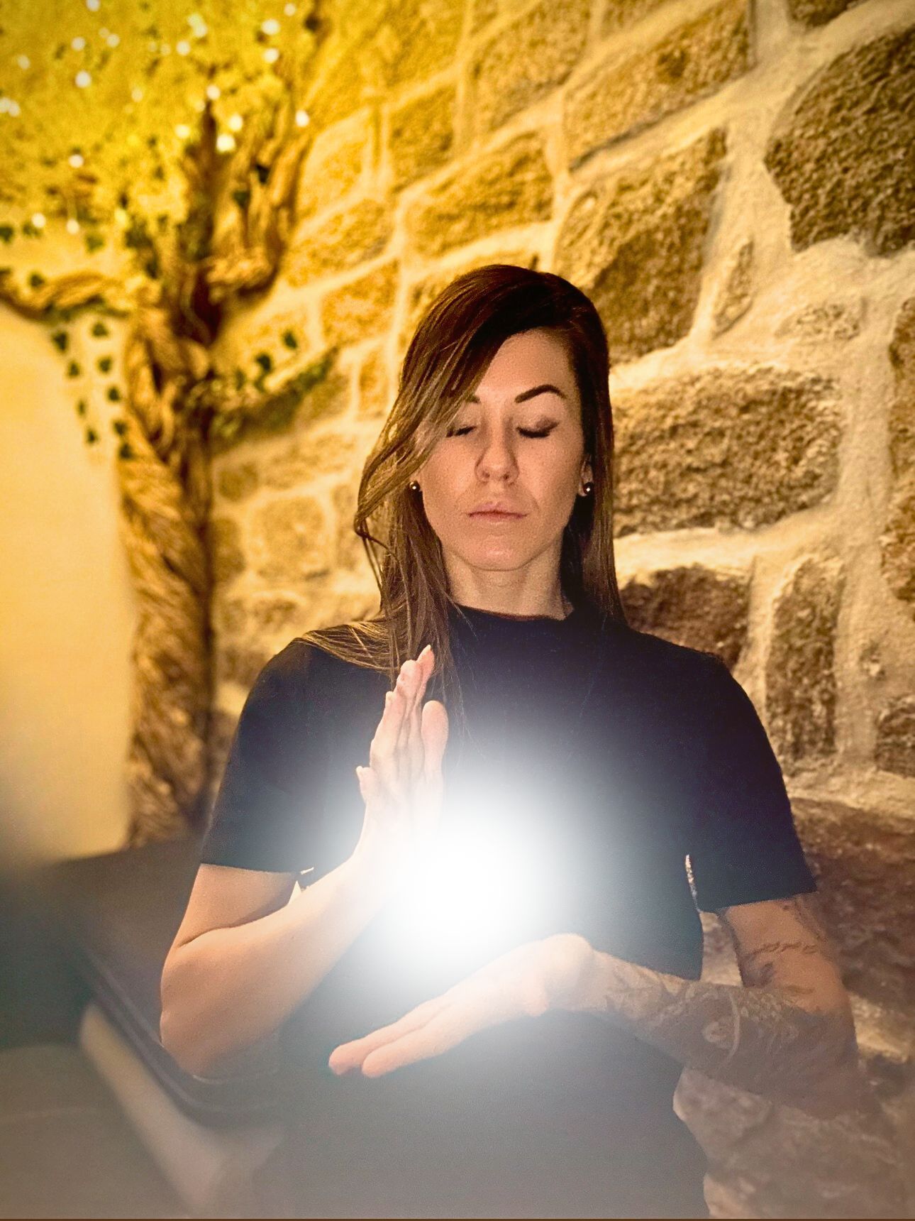 Man lying on a mat with eyes closed in a relaxation or meditation pose beside a burning incense bowl.